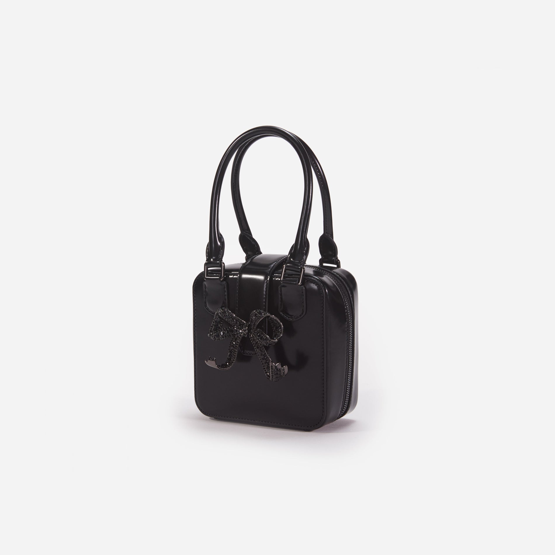 Side view of a woman wearing the Black Leather Square Mini Tote Bag