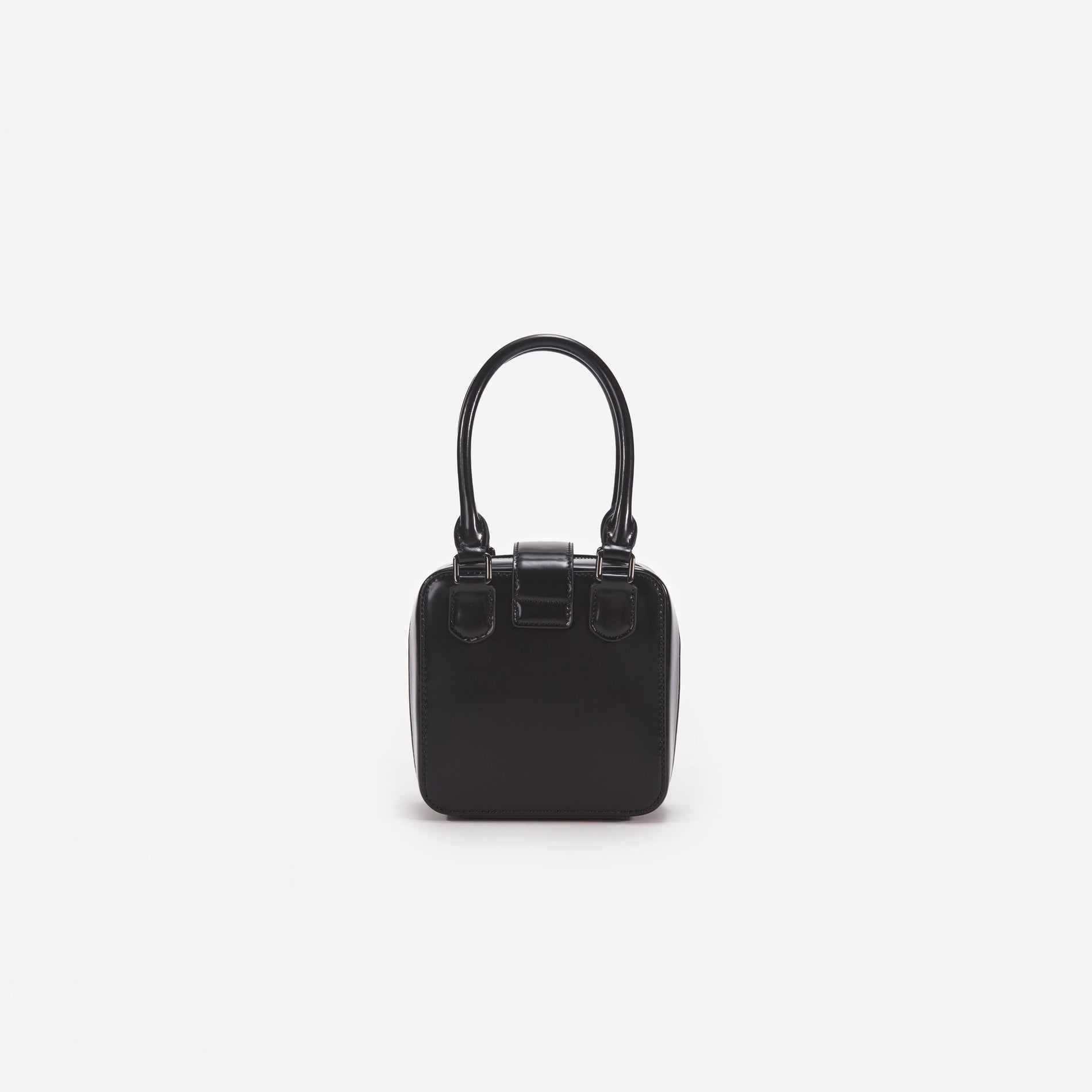 Back view of a woman wearing the White Black Leather Square Mini Tote Bag