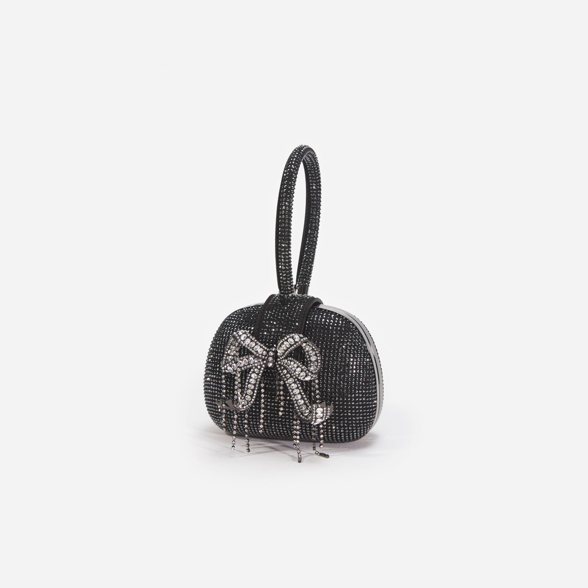 Side view of a woman wearing the Black Rhinestone Top Handle Clutch Bag