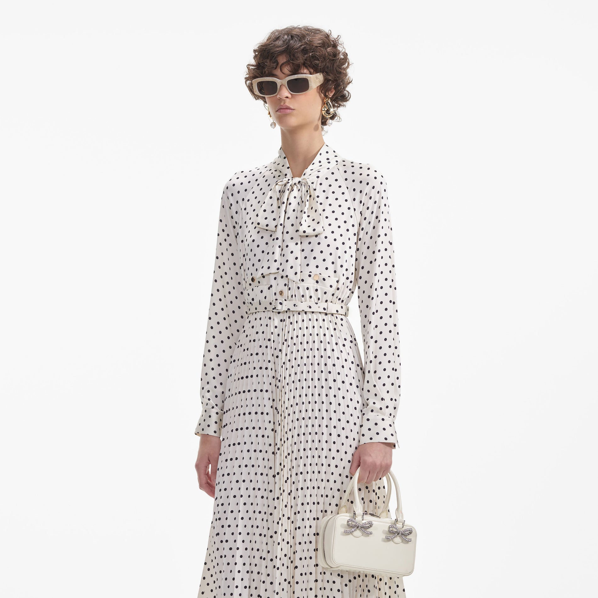 A close up of a woman wearing the Gold Faux Pearl Drop Earrings