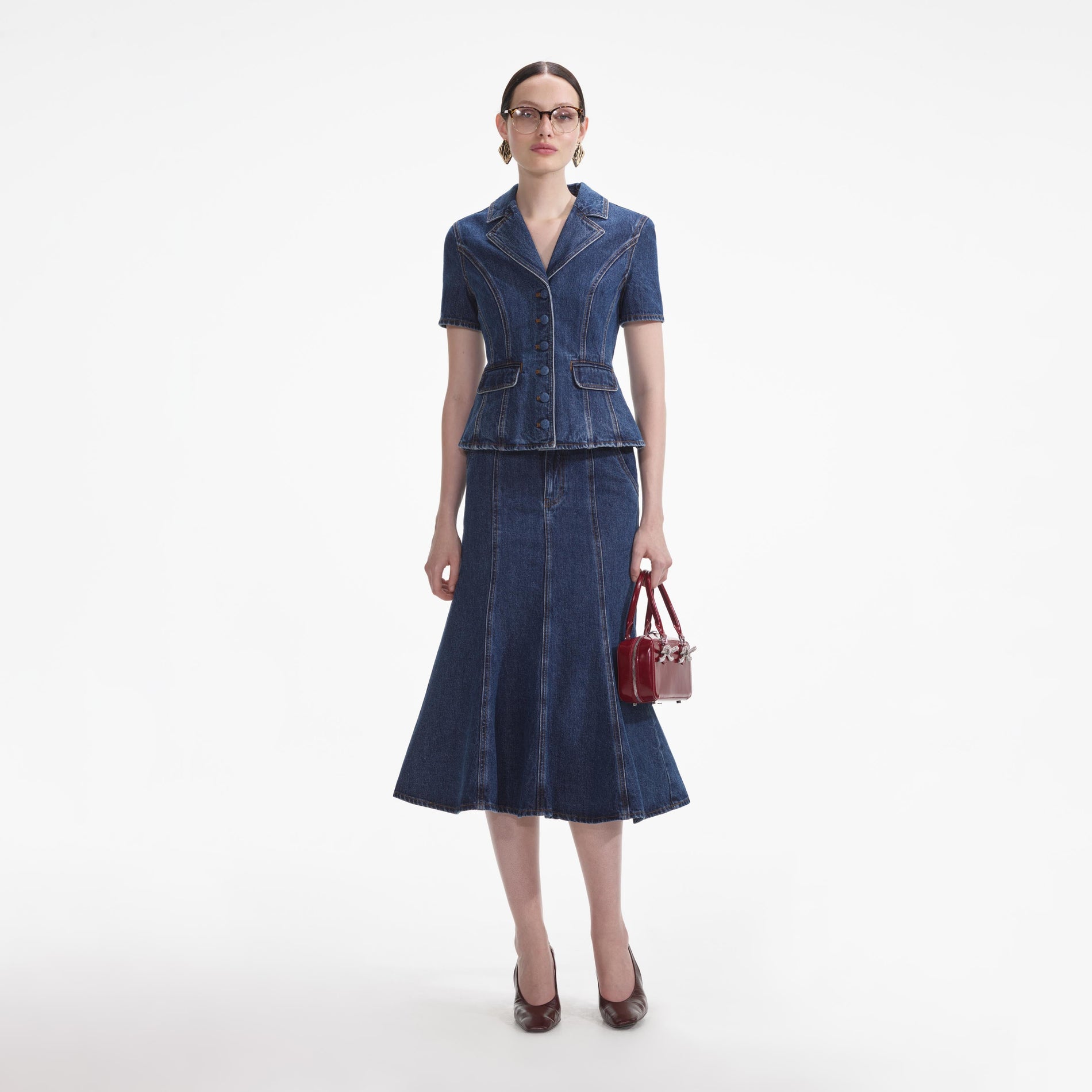 Front view of a woman wearing the Flared Denim Midi Dress