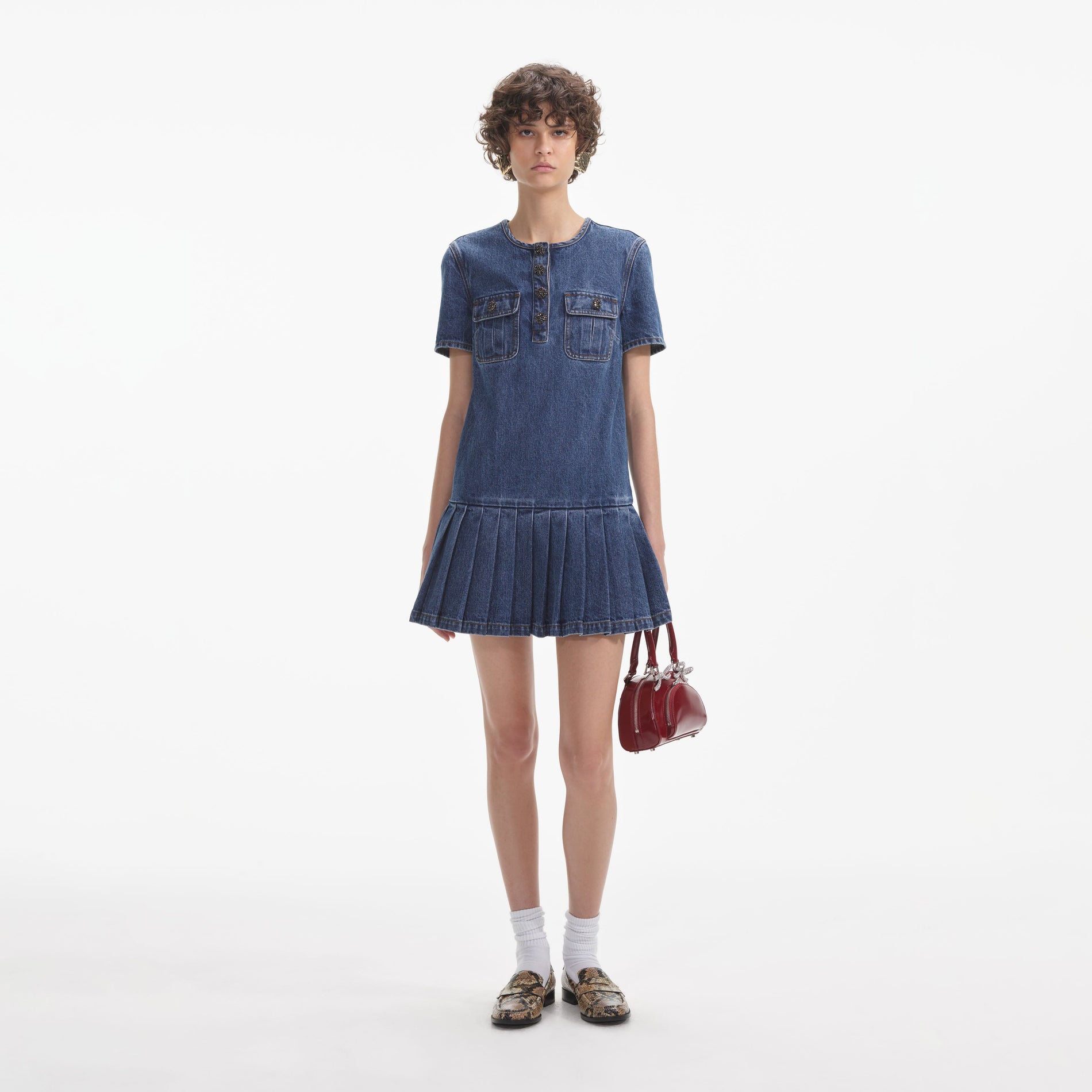 Front view of a woman wearing the Pleated Denim Mini Dress