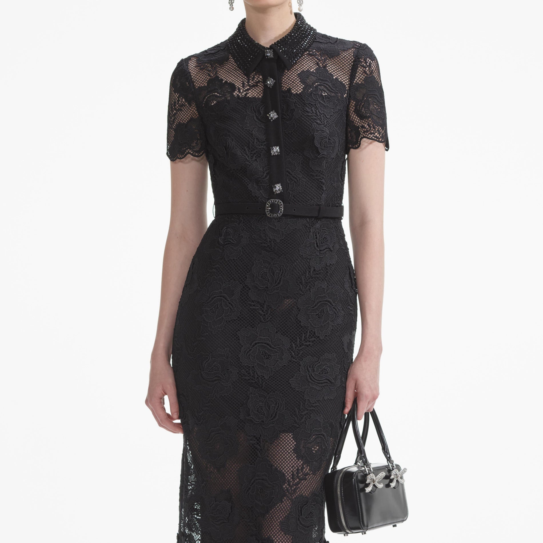 A close up of a woman wearing the Black Lace Diamante Midi Dress