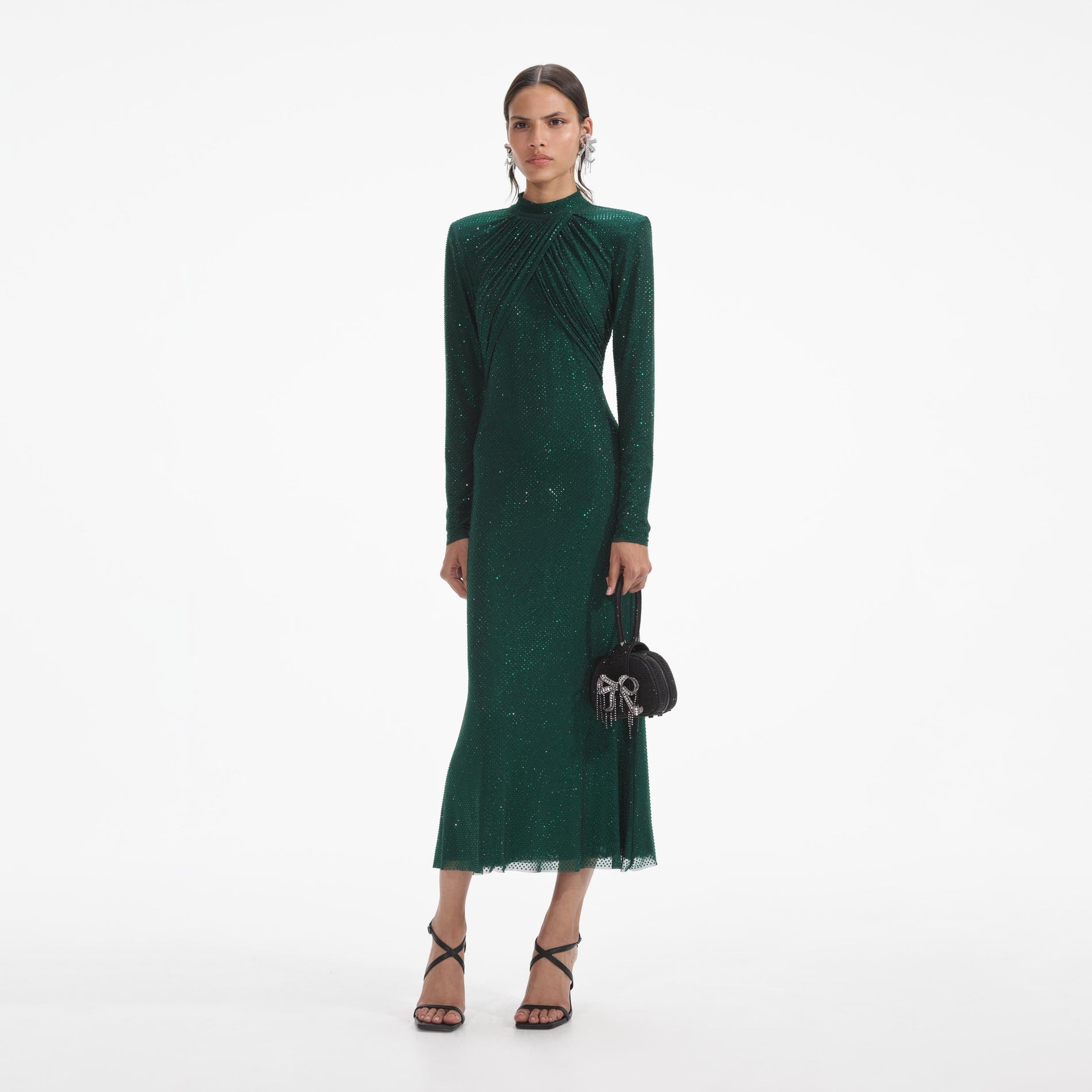 Side view of a woman wearing the Green Rhinestone Mesh Midi Dress