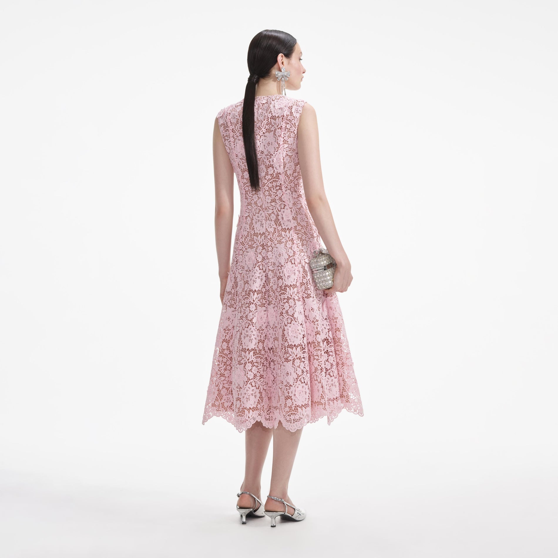 Back view of a woman wearing the Pink Flower Lace Midi Dress