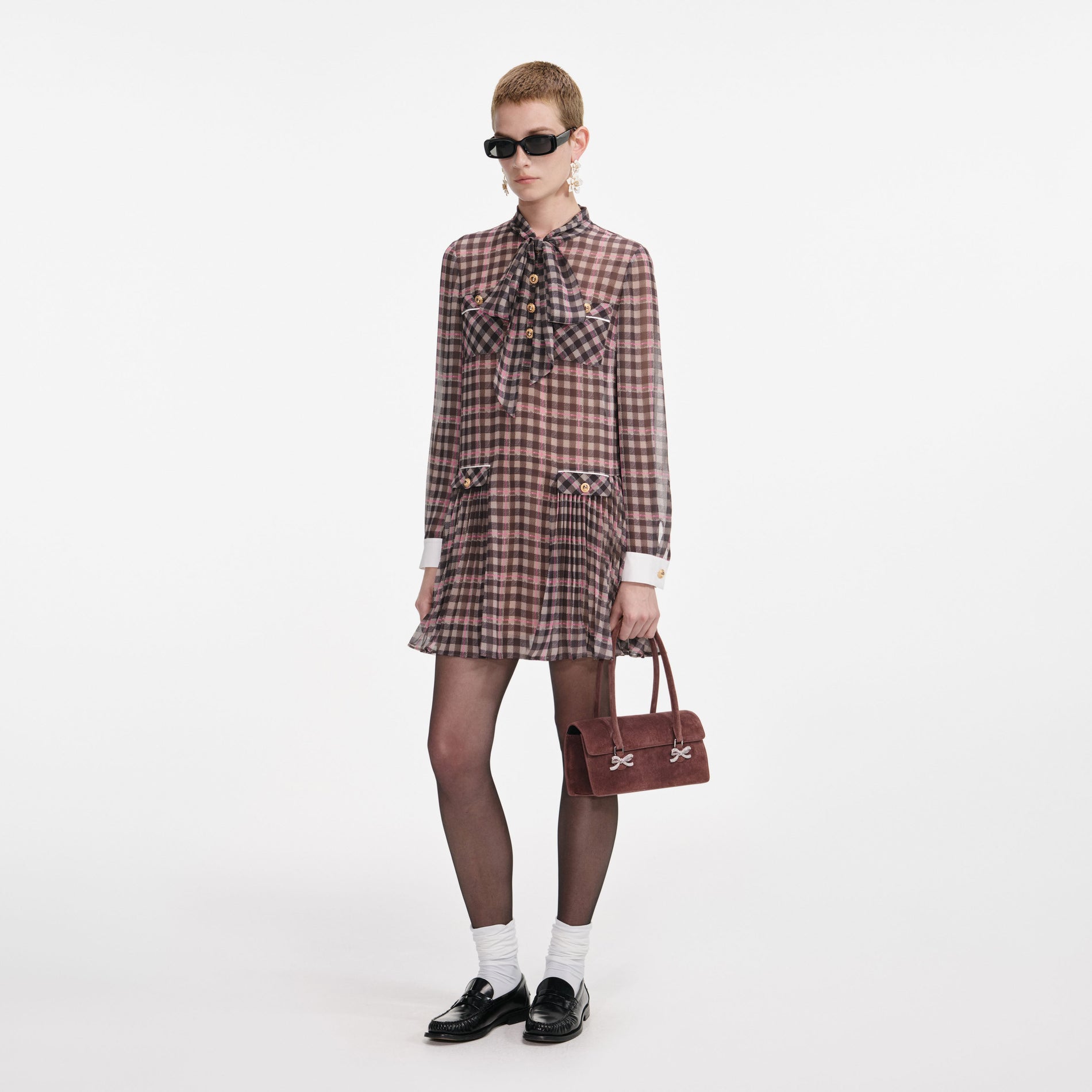 Side view of a woman wearing the Brown Check Chiffon Mini Dress