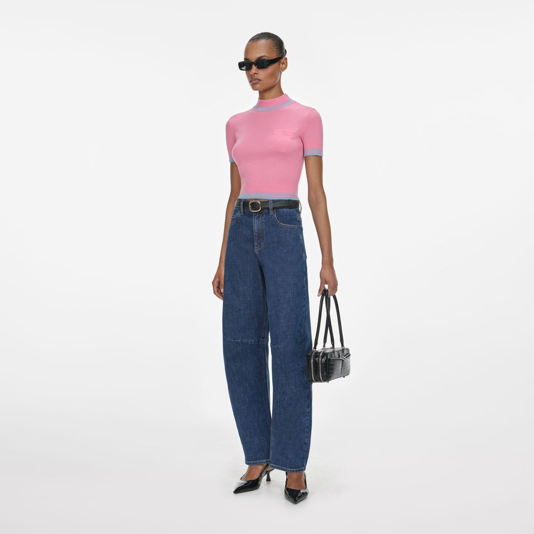 Side view of a woman wearing the Blue Barrel Leg Jeans