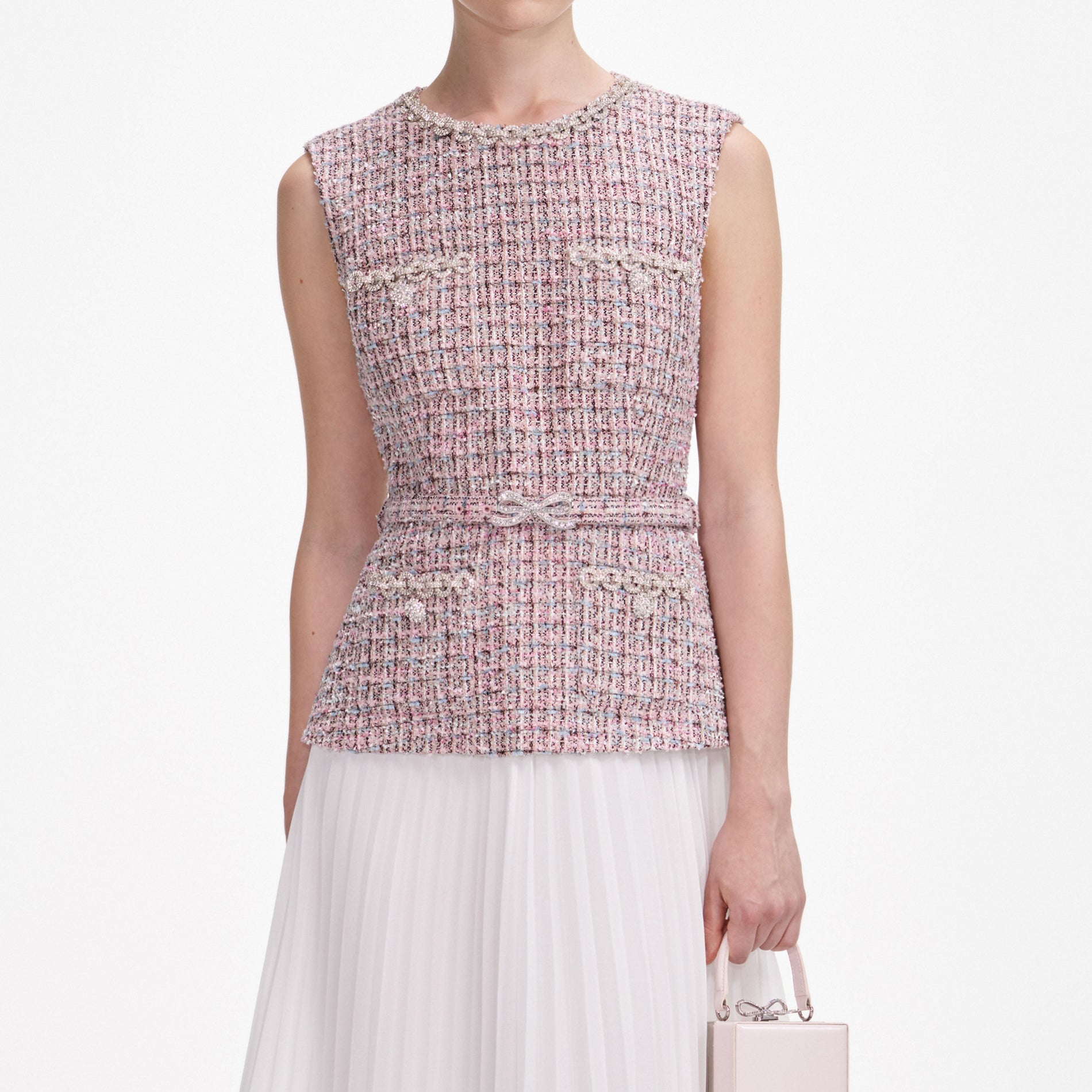 A close up of a woman wearing the Pink Boucle Chiffon Midi Dress