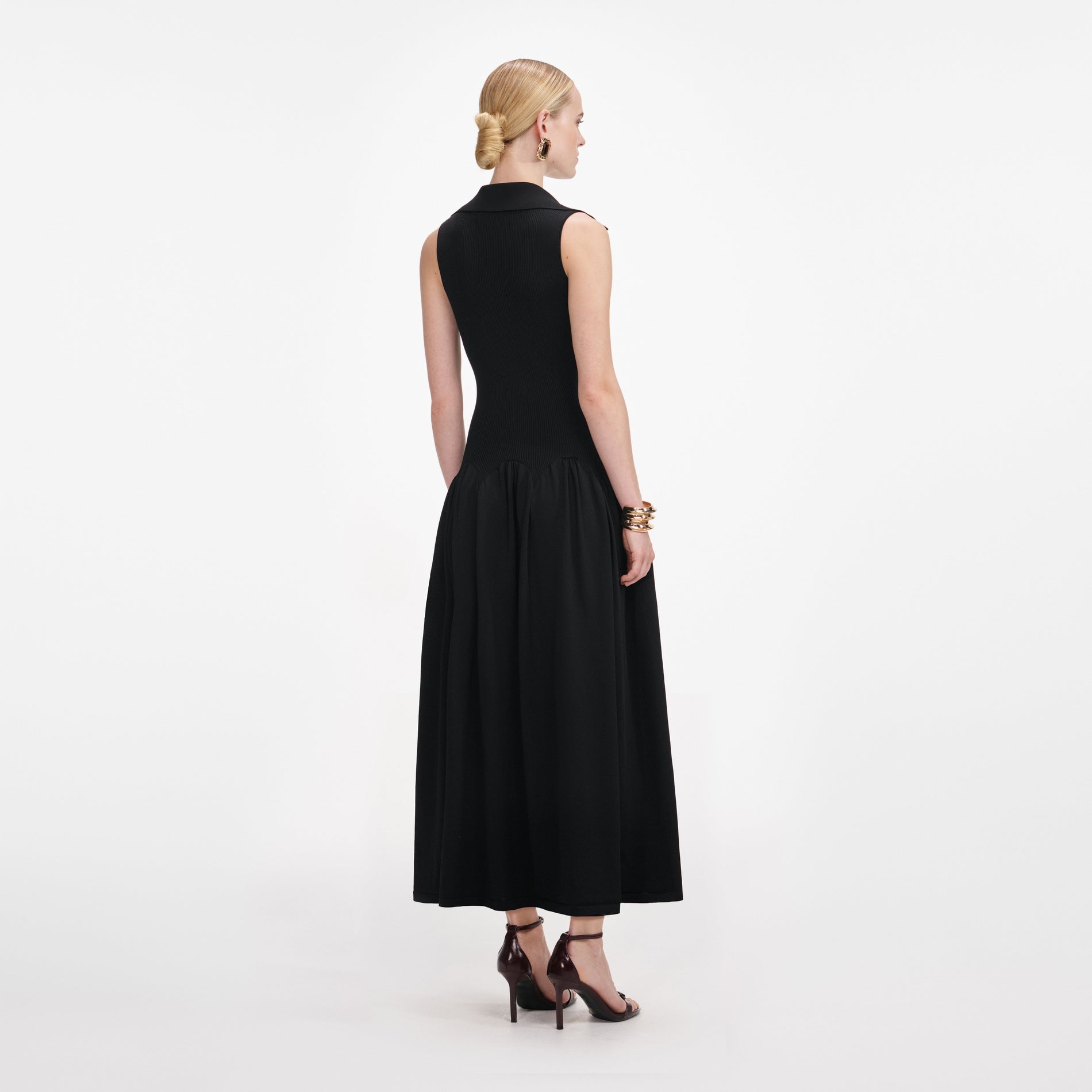 Back view of a woman wearing the Black Ribbed Knit Midi Dress