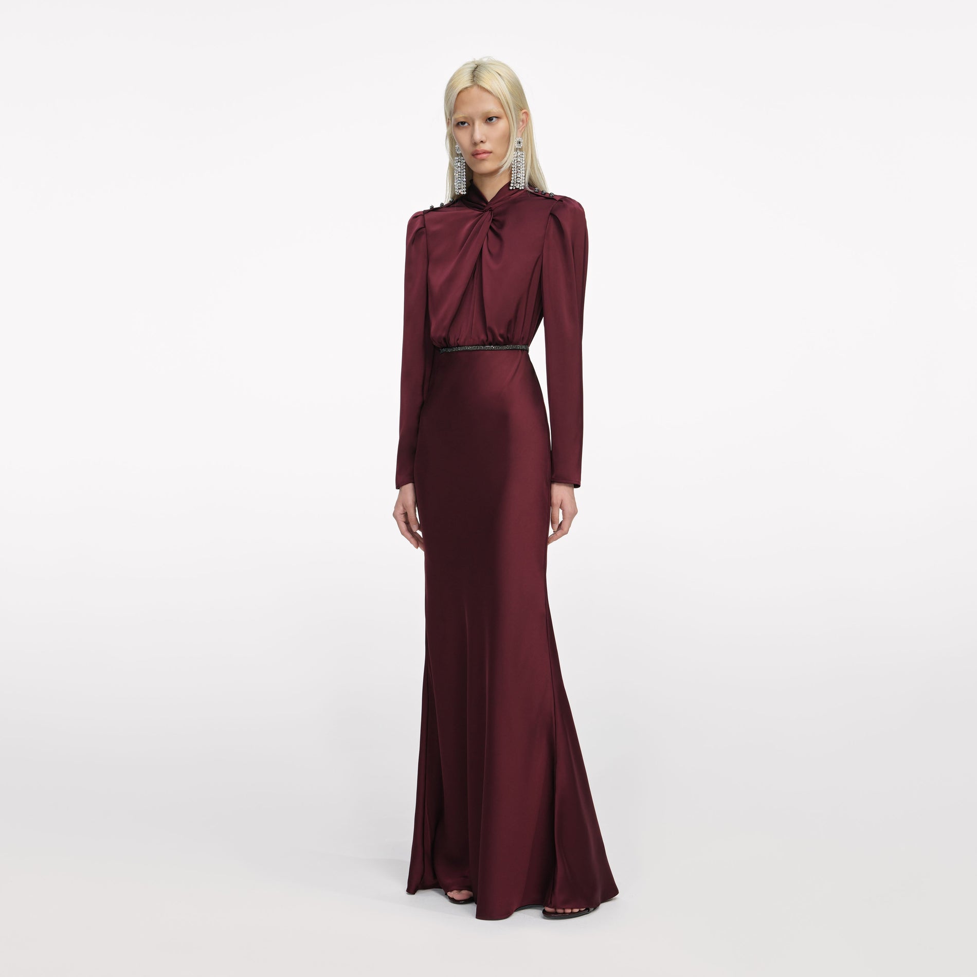 Side view of a woman wearing the Burgundy Satin Maxi Dress