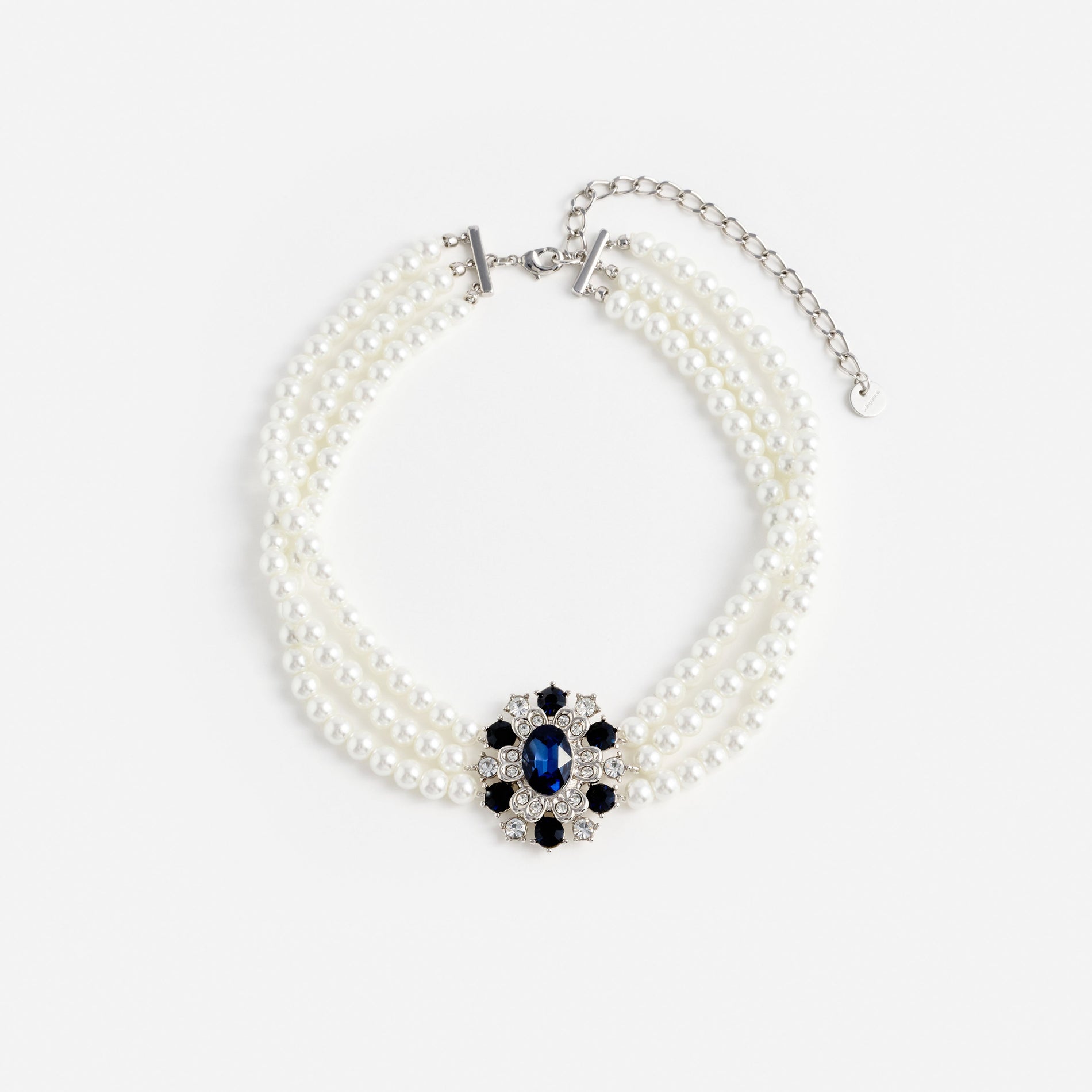 Three strand pearl necklace with a blue and clear gemstone floral pendant