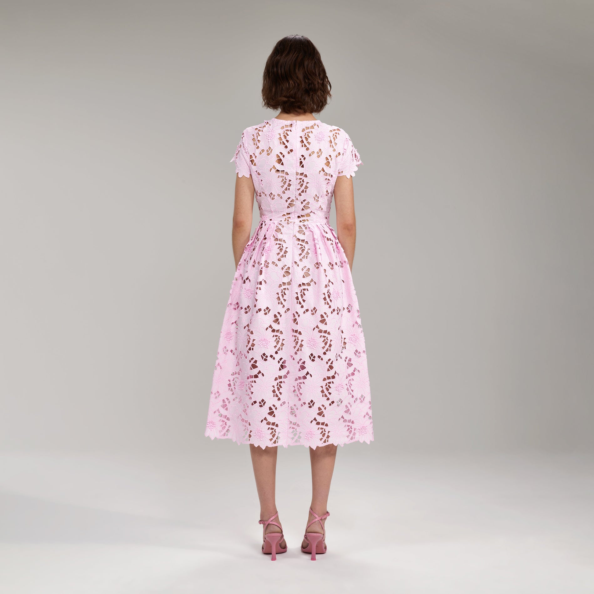 A woman wearing the Peony Midi Dress