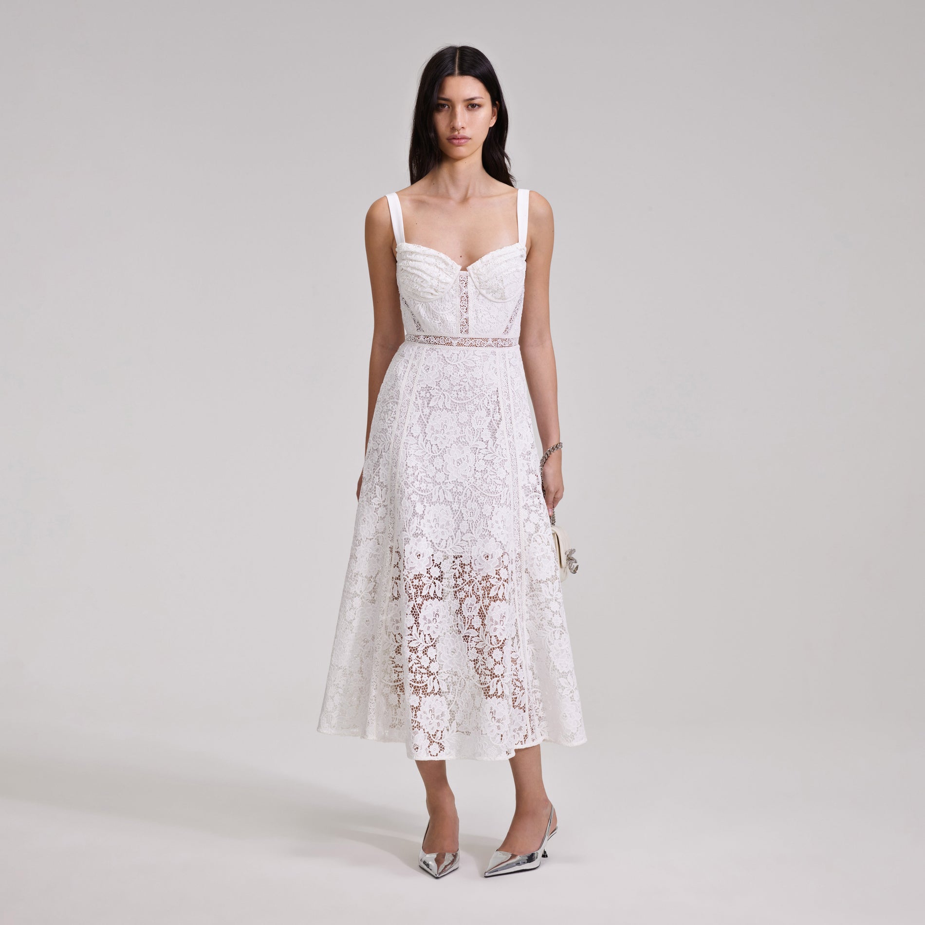 A woman wearing the White Cord Lace Midi Dress