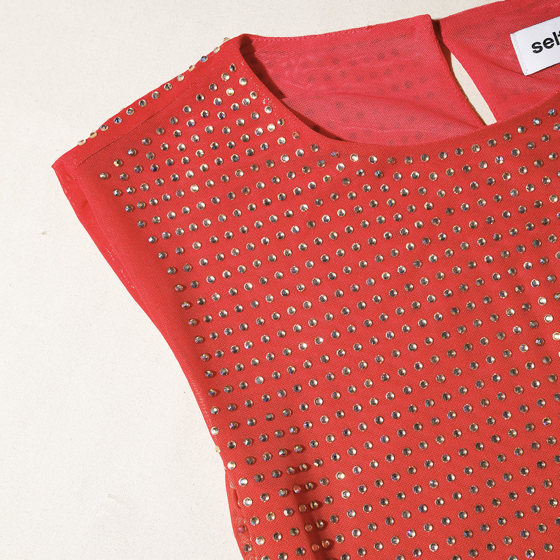 A close up of the fabric for the Pink Rhinestone Mesh Mini Dress