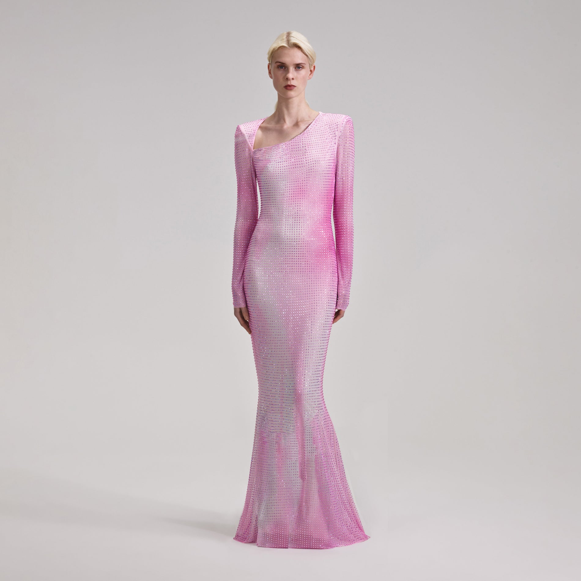 A woman wearing the Pink Contour Flared Hem Maxi Dress