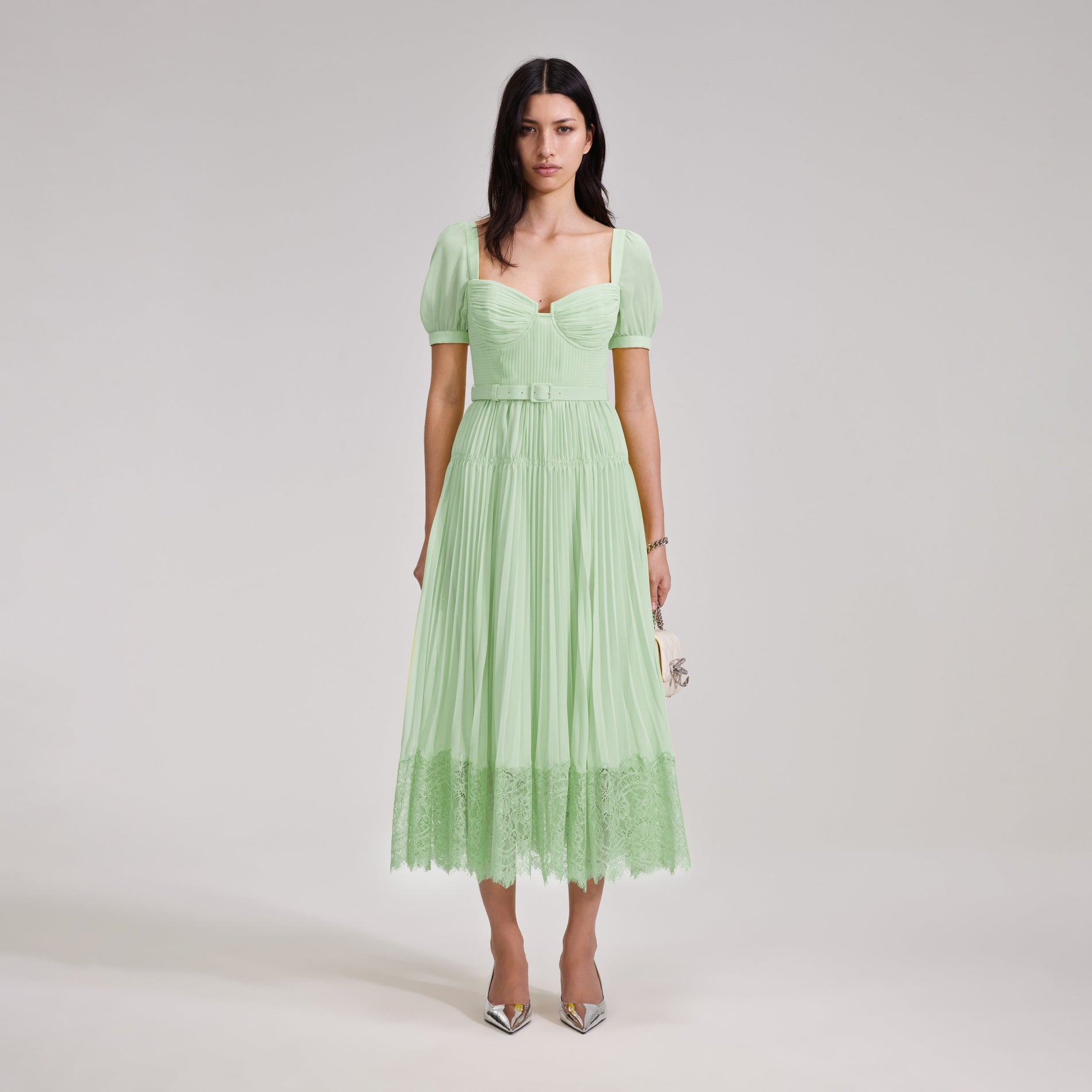 A woman wearing the Green Chiffon Lace Detail Midi Dress