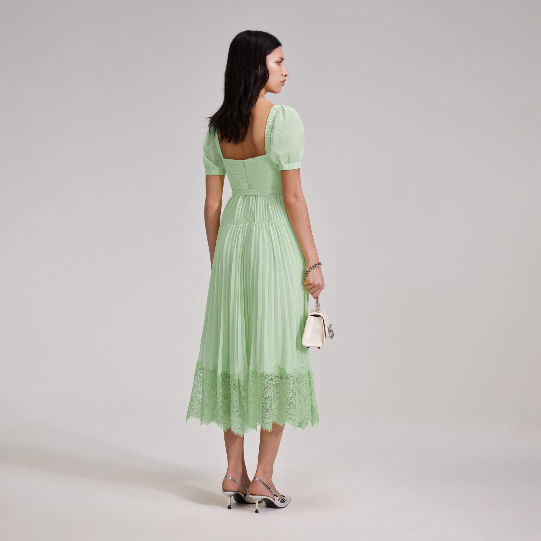 A woman wearing the Green Chiffon Lace Detail Midi Dress