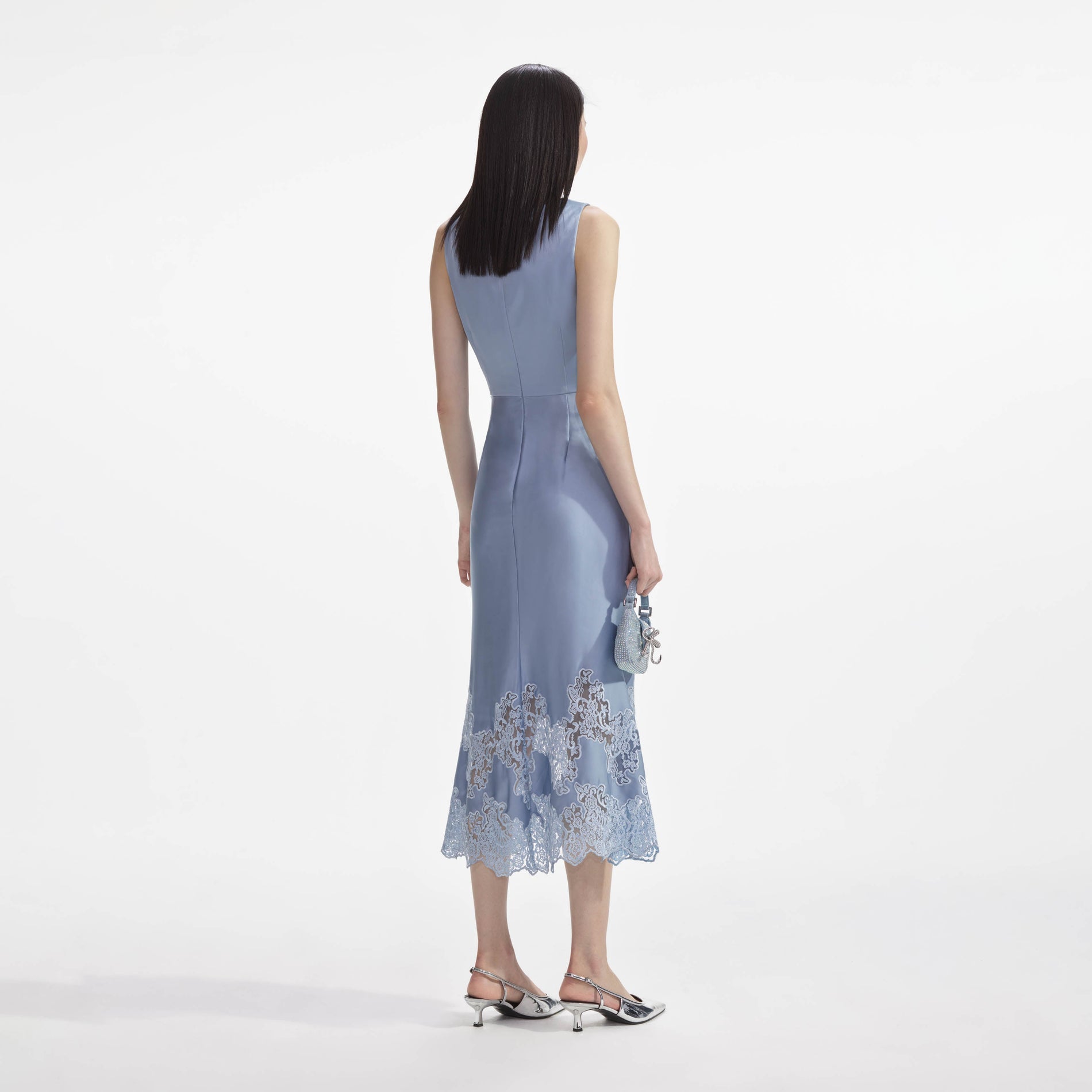 Back view of a woman wearing the Blue Satin Lace Insert Midi Dress