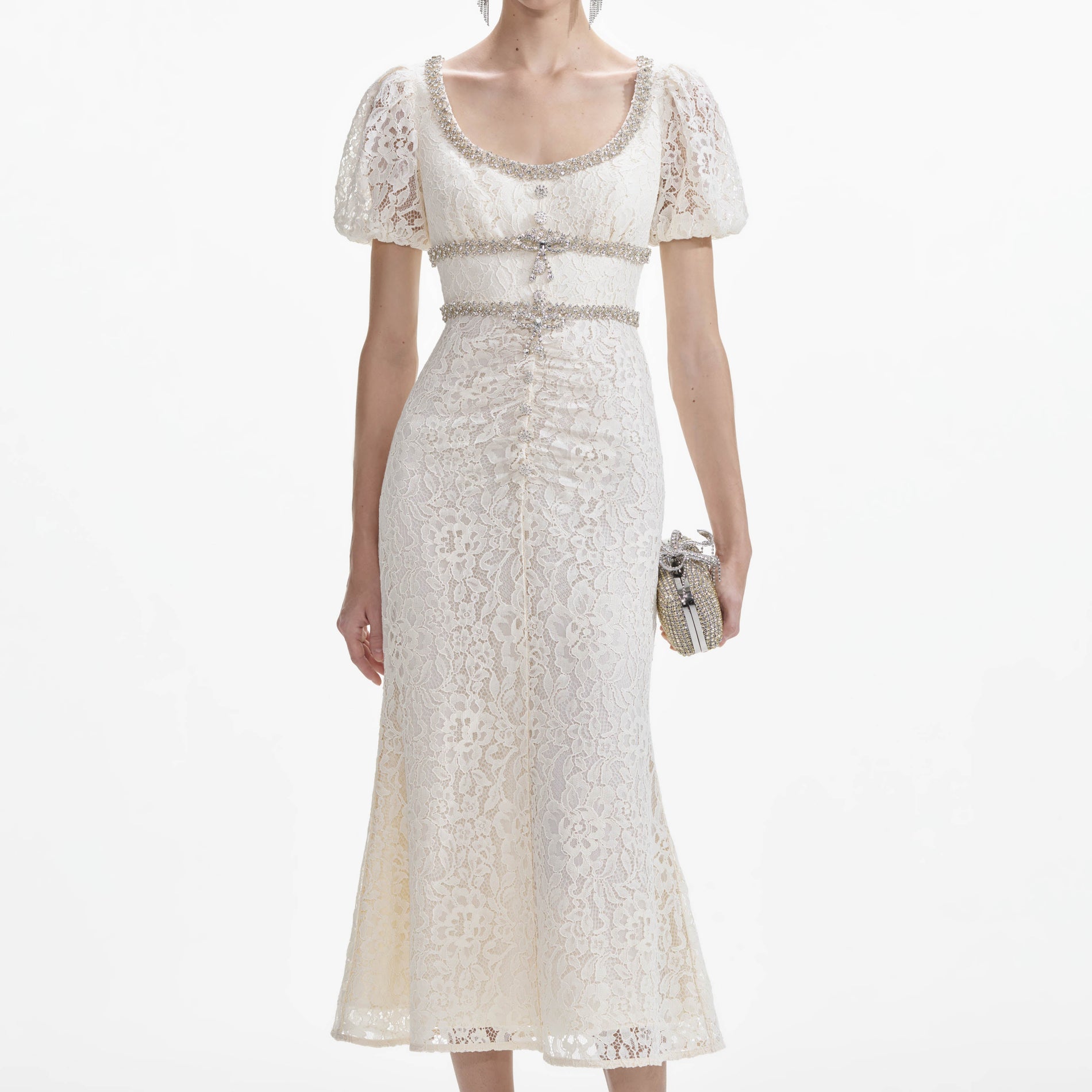 A close up of a woman wearing the Cream Lace Diamante Trim Midi Dress