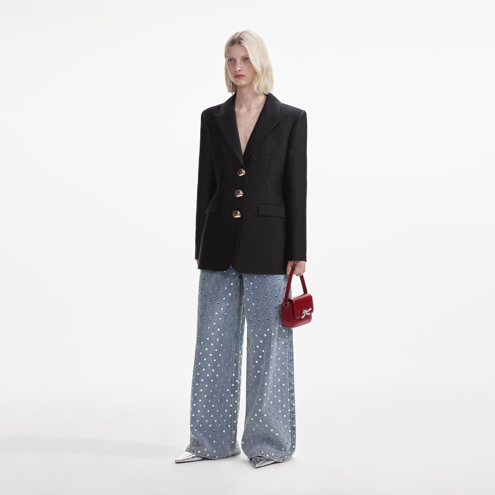 Side view of a woman wearing the Black Taffeta Blazer