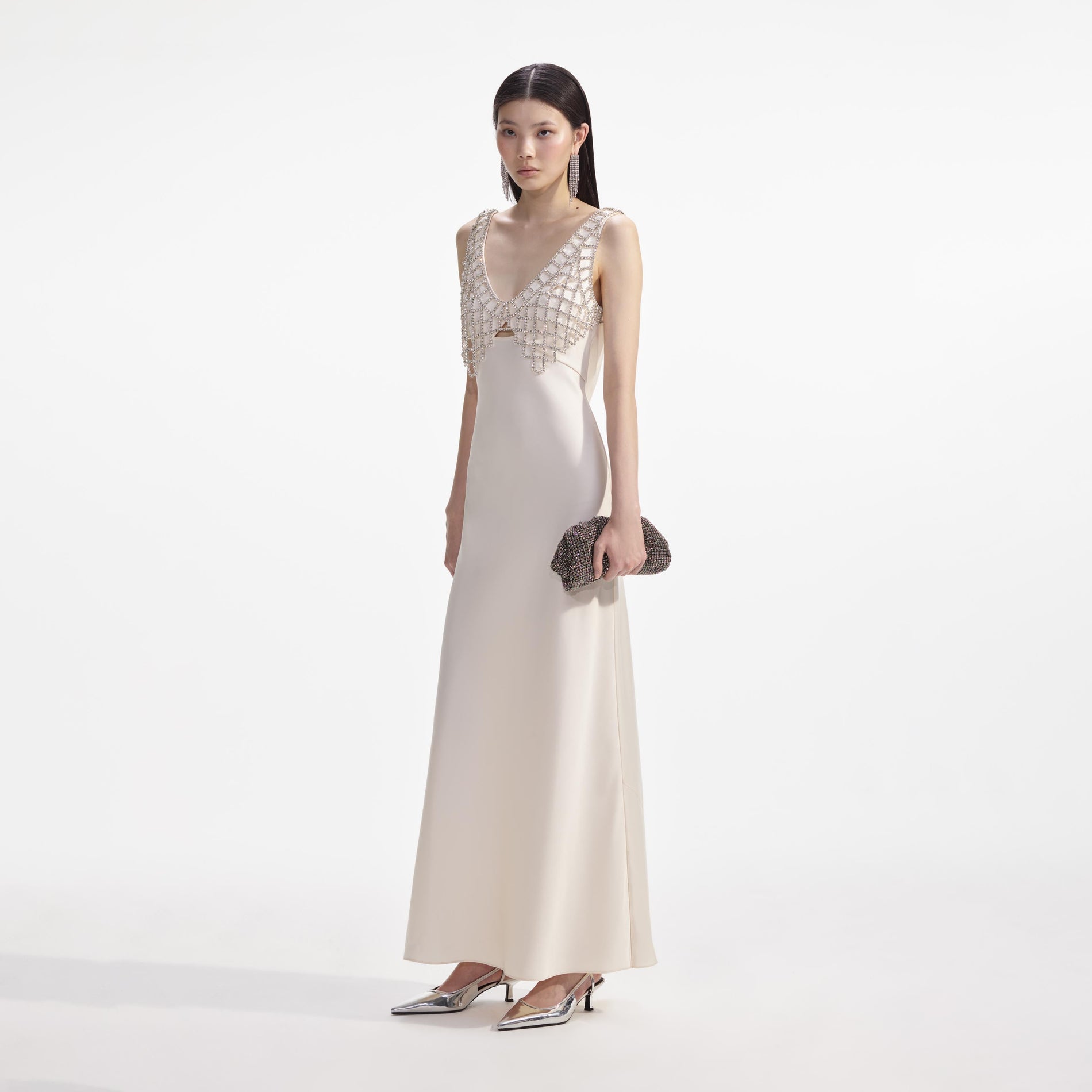Side view of a woman wearing the Cream Satin Diamante Bralette Maxi Dress