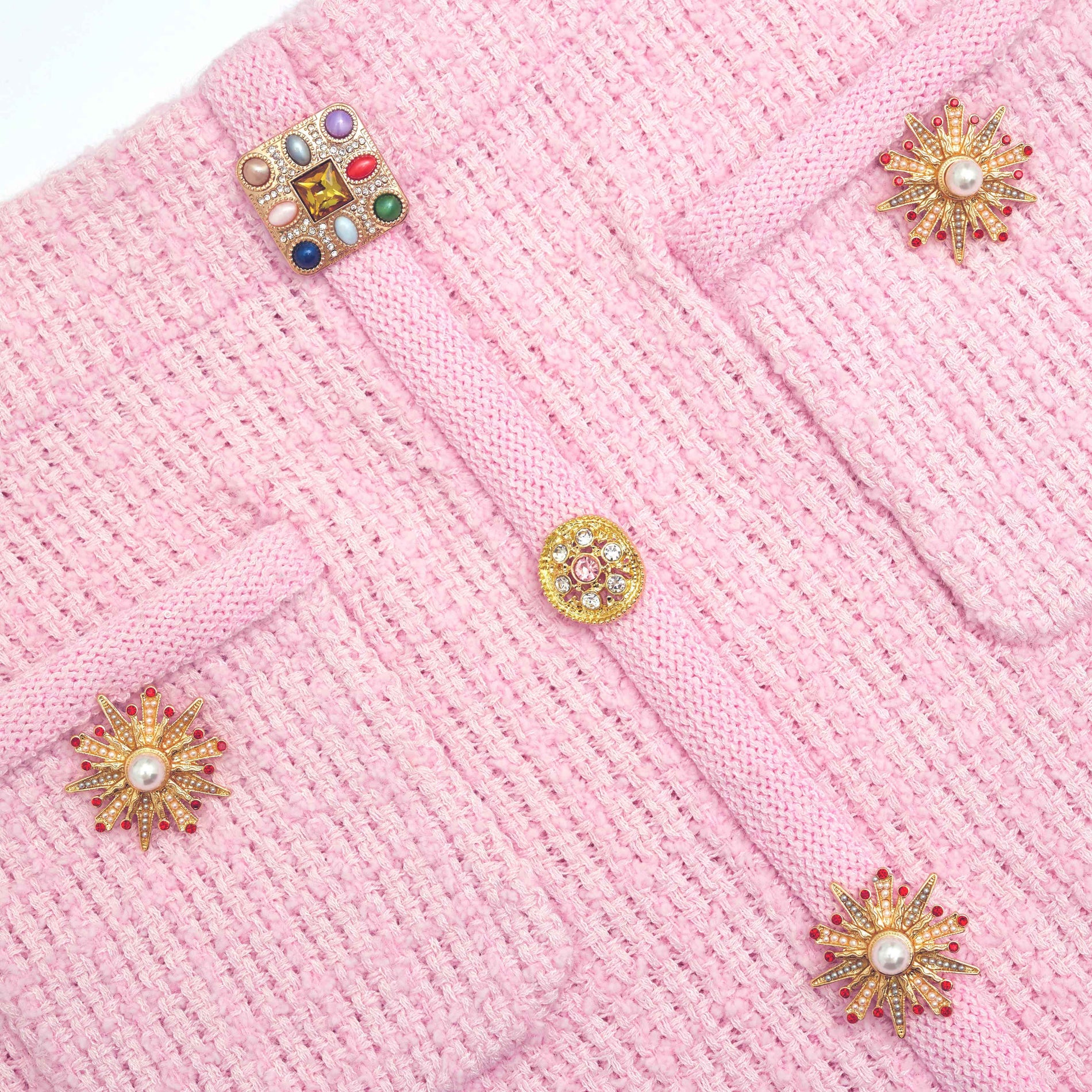 A close up of the fabric for the Pink Jewel Button Knit Mini Skirt