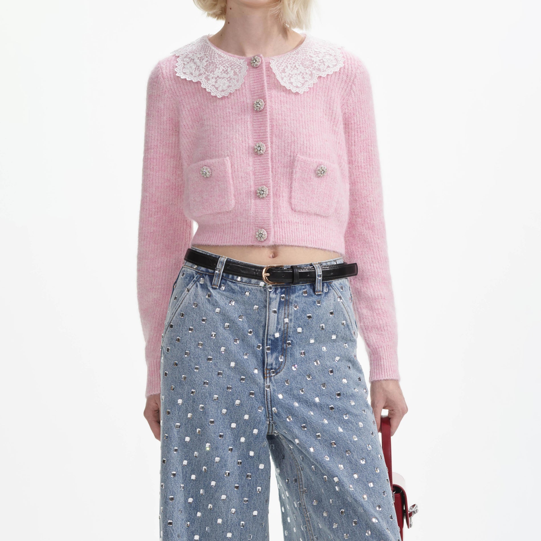 A close up of a woman wearing the Pink Fluffy Rib Knit Cardigan