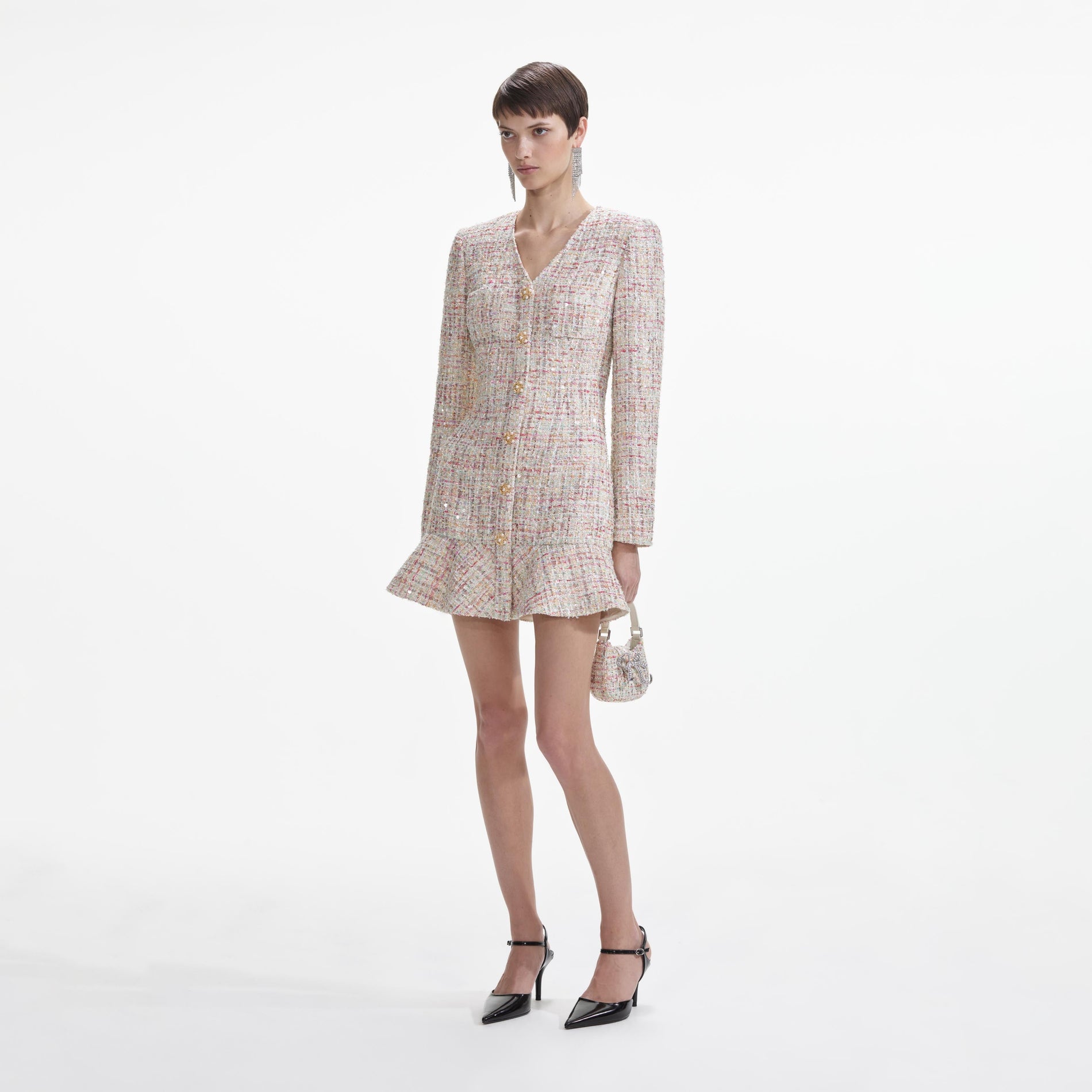 Side view of a woman wearing the Pastel Boucle V-Neck Mini Dress