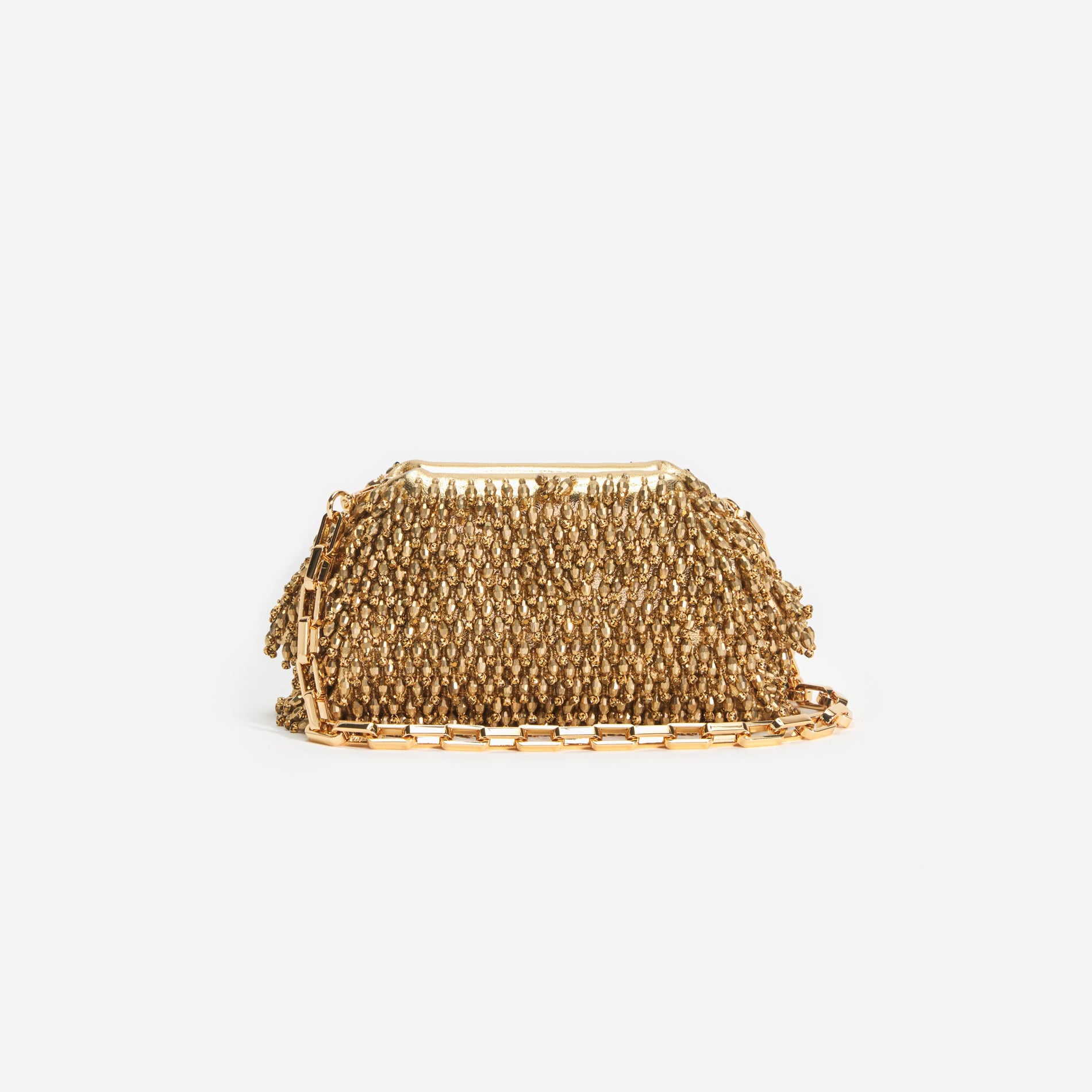 A close up of a woman wearing the Gold Crystal Clutch
