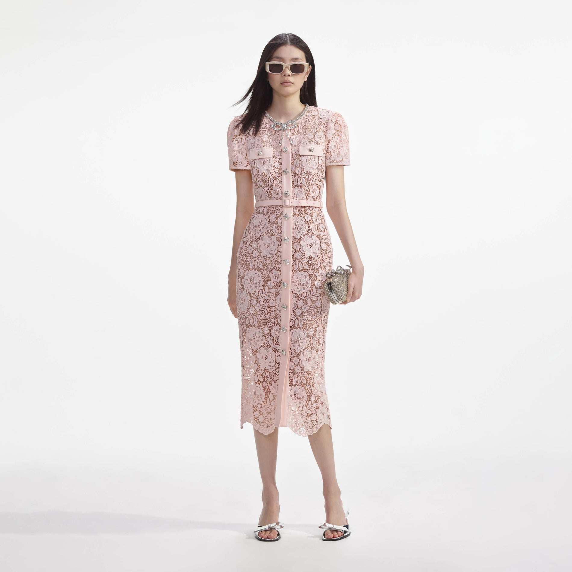 Front view of a woman wearing the Pink Lace Diamante Bow Midi Dress