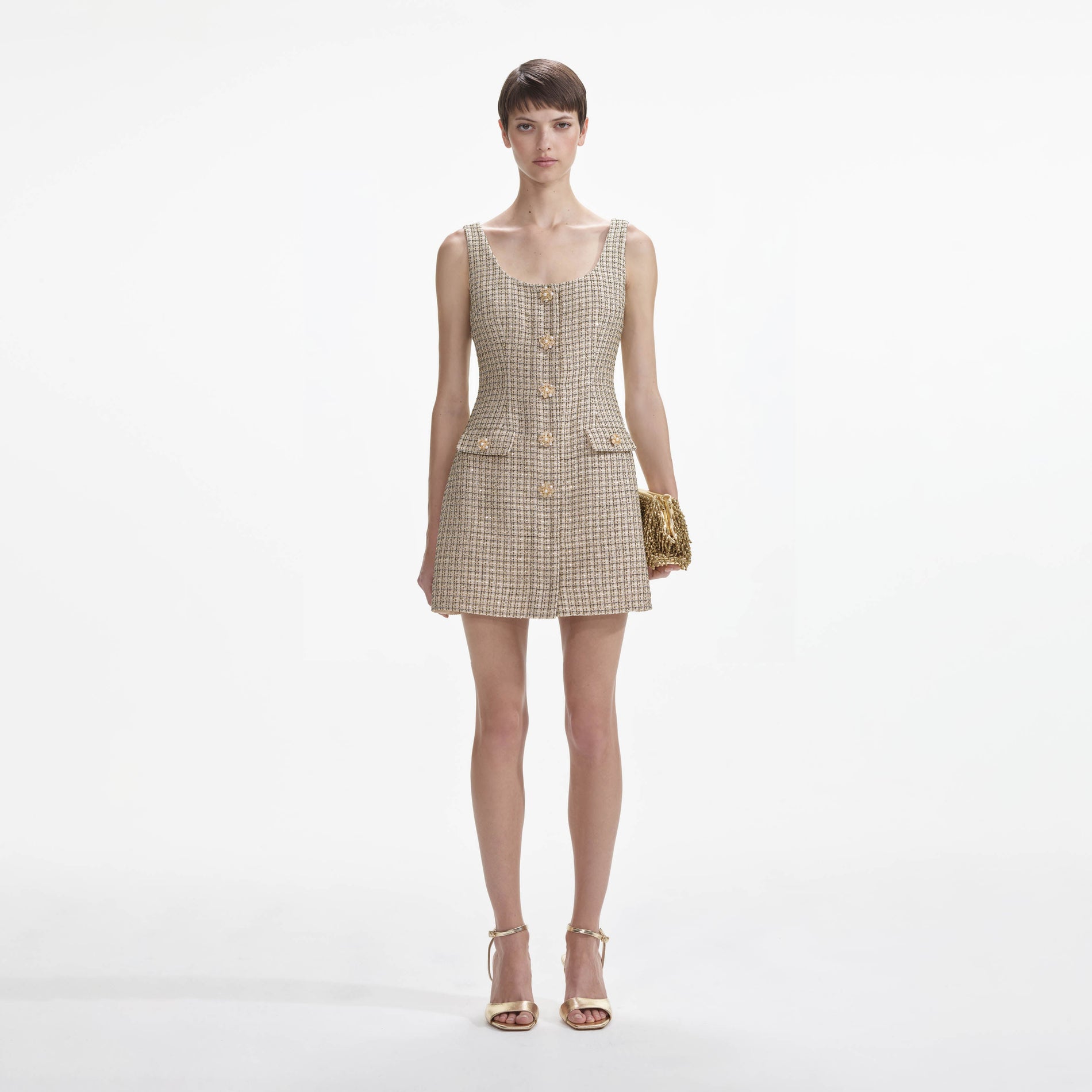 Front view of a woman wearing the Gold Boucle Mini Dress