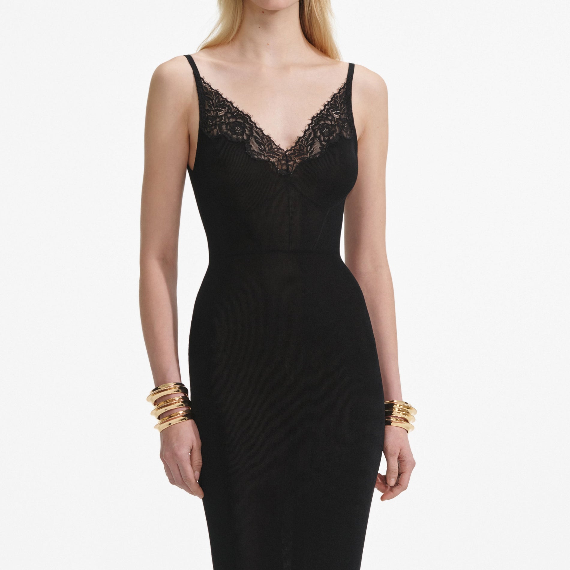 A close up of a woman wearing the Black Viscose Knit Maxi Dress