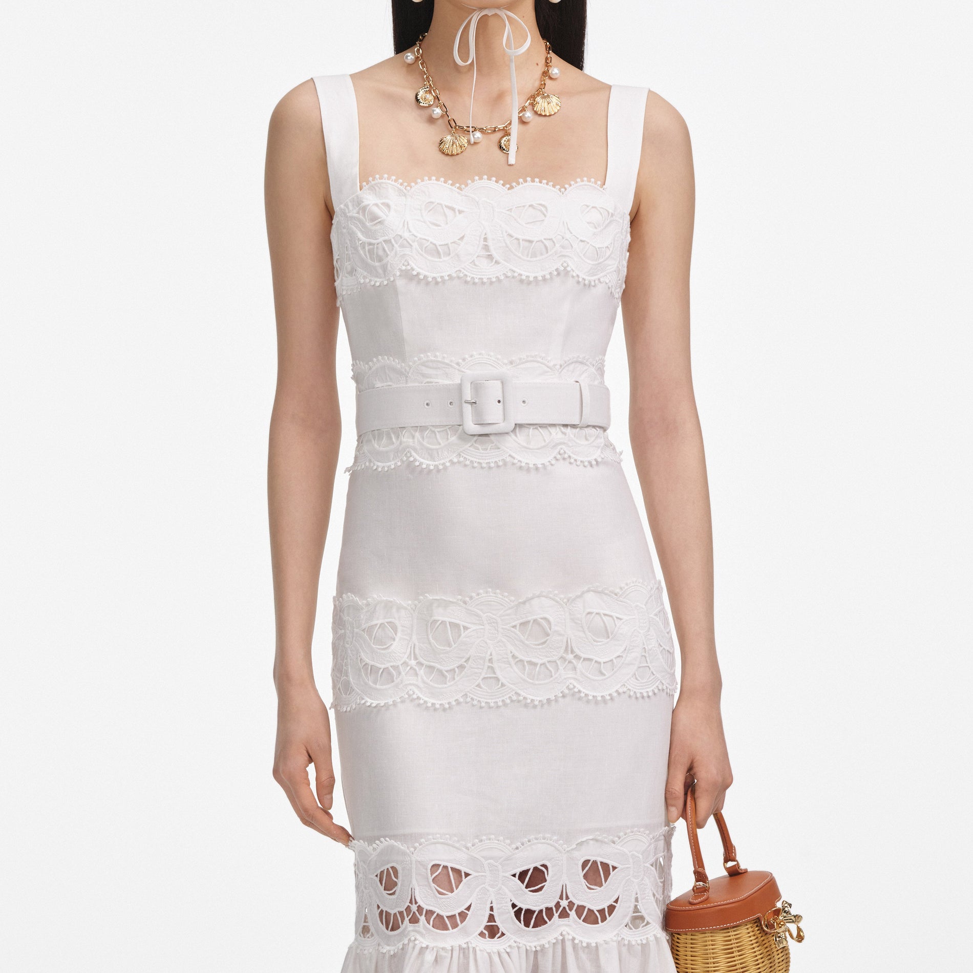 A close up of a woman wearing the White Linen Lace Insert Midi Dress