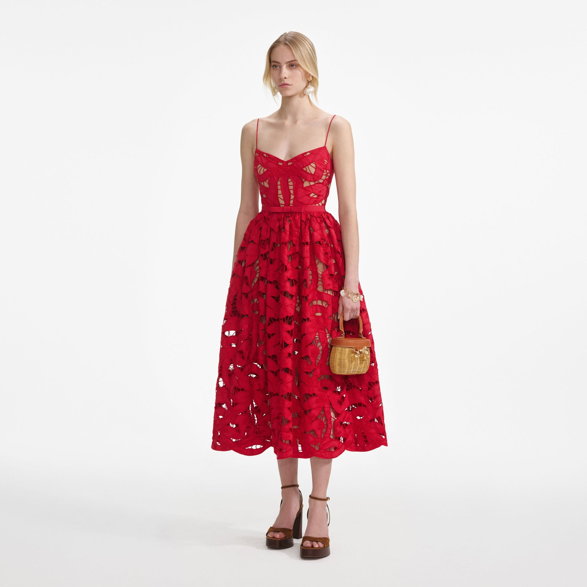 Side view of a woman wearing the Red Bow Embroidered Midi Dress