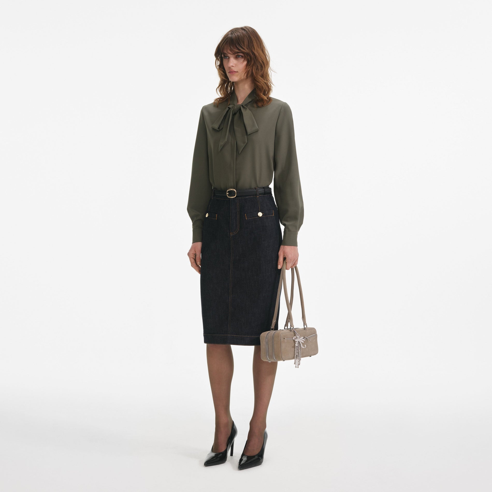 Side view of a woman wearing the Khaki Twill Pussy Bow Blouse