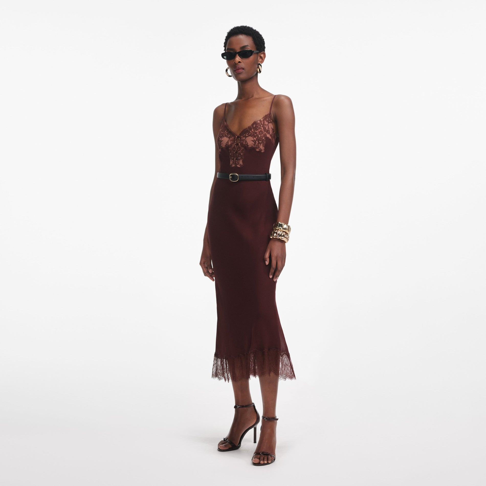 Side view of a woman wearing the Brown Lace Insert Midi Dress