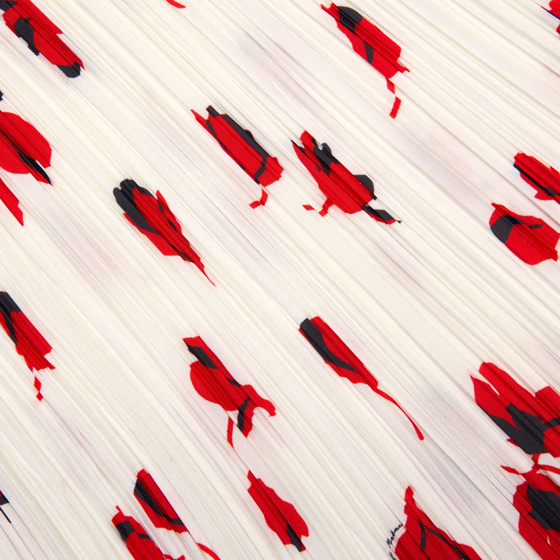 A close up of the fabric for the White Floral Plisse Midi Skirt