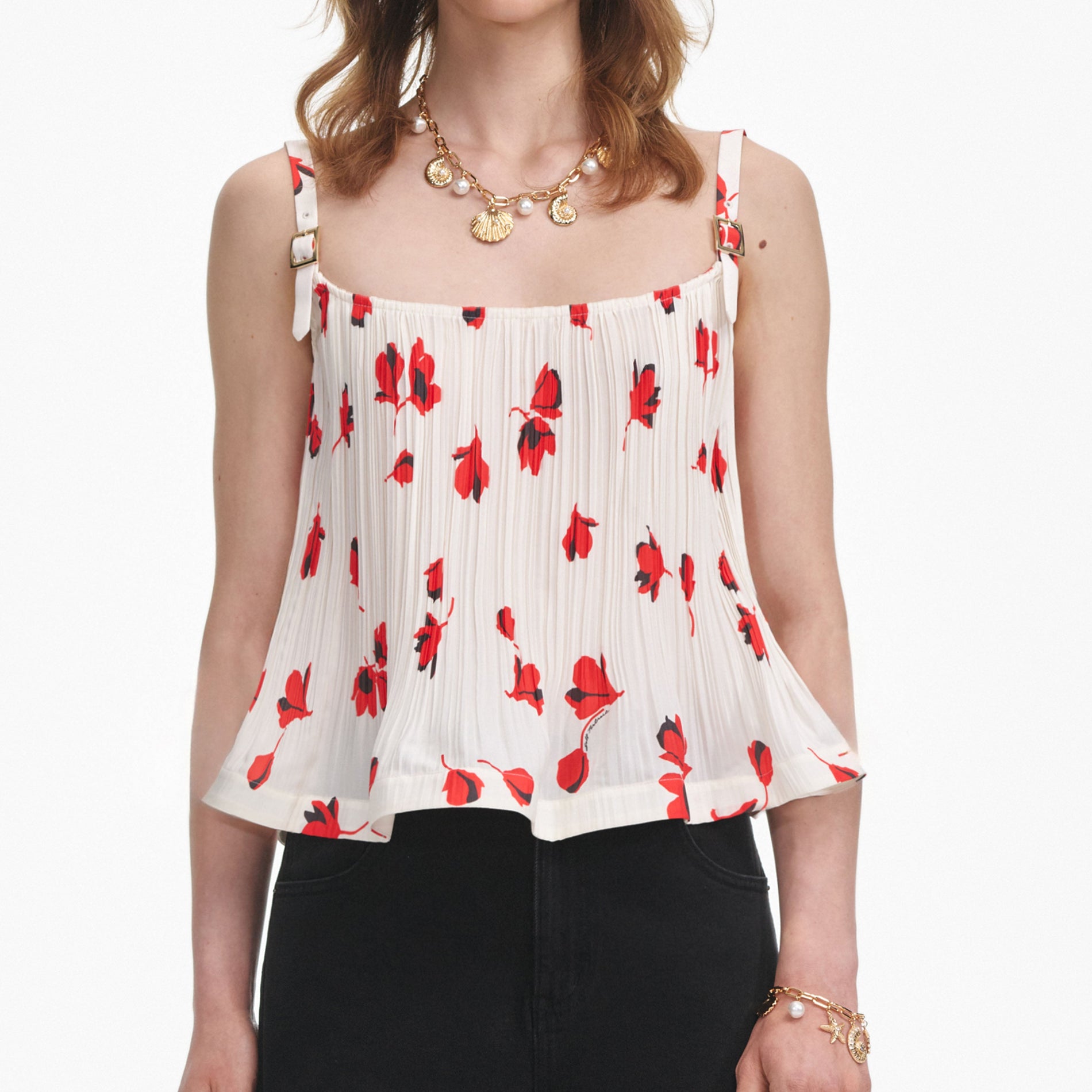 A close up of a woman wearing the White Floral Plisse  Top