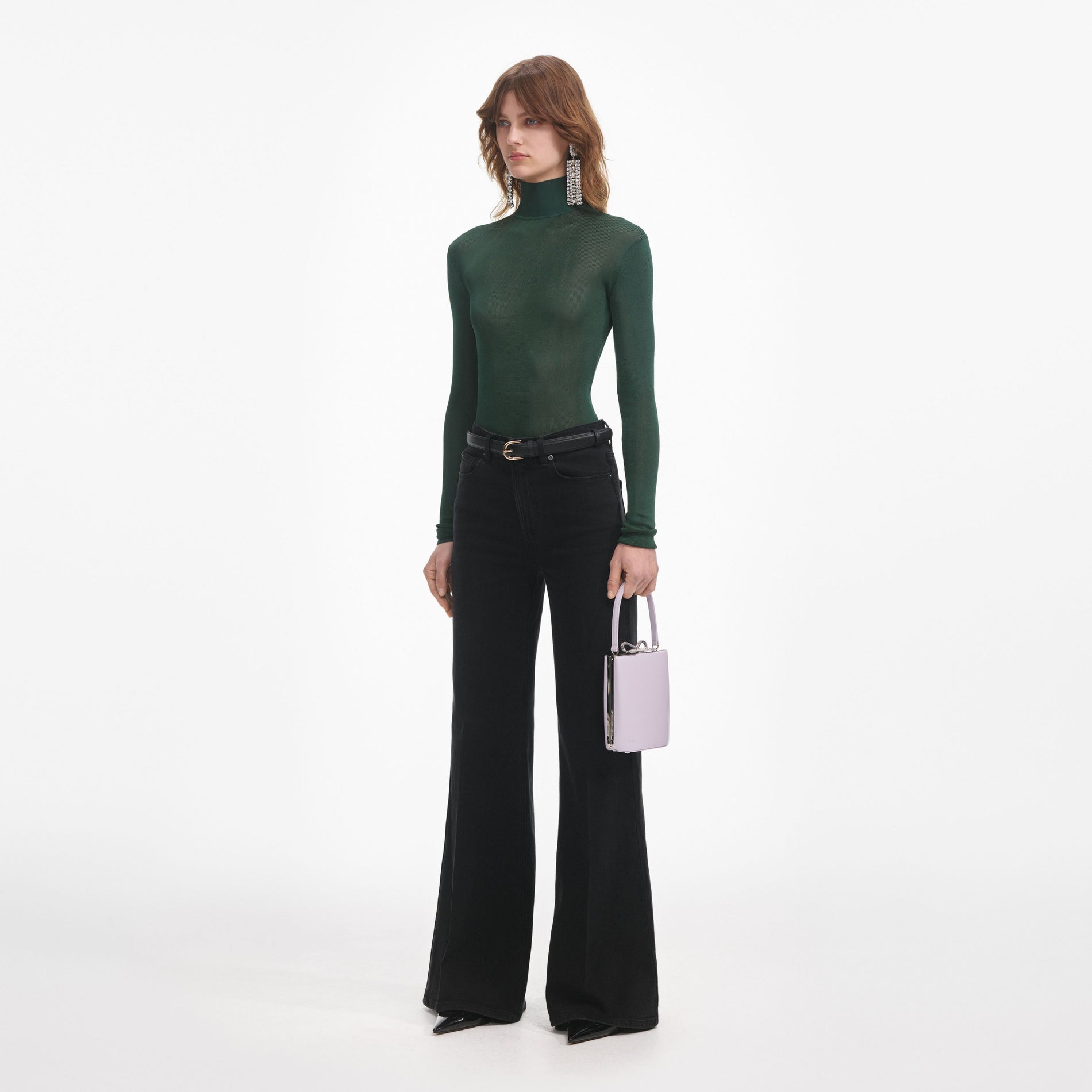 Side view of a woman wearing the Green Viscose Knit Top