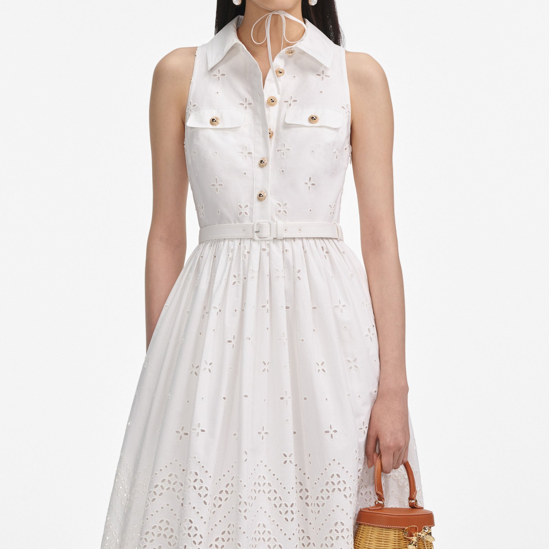 A close up of a woman wearing the White Cotton Broderie Collared Midi Dress