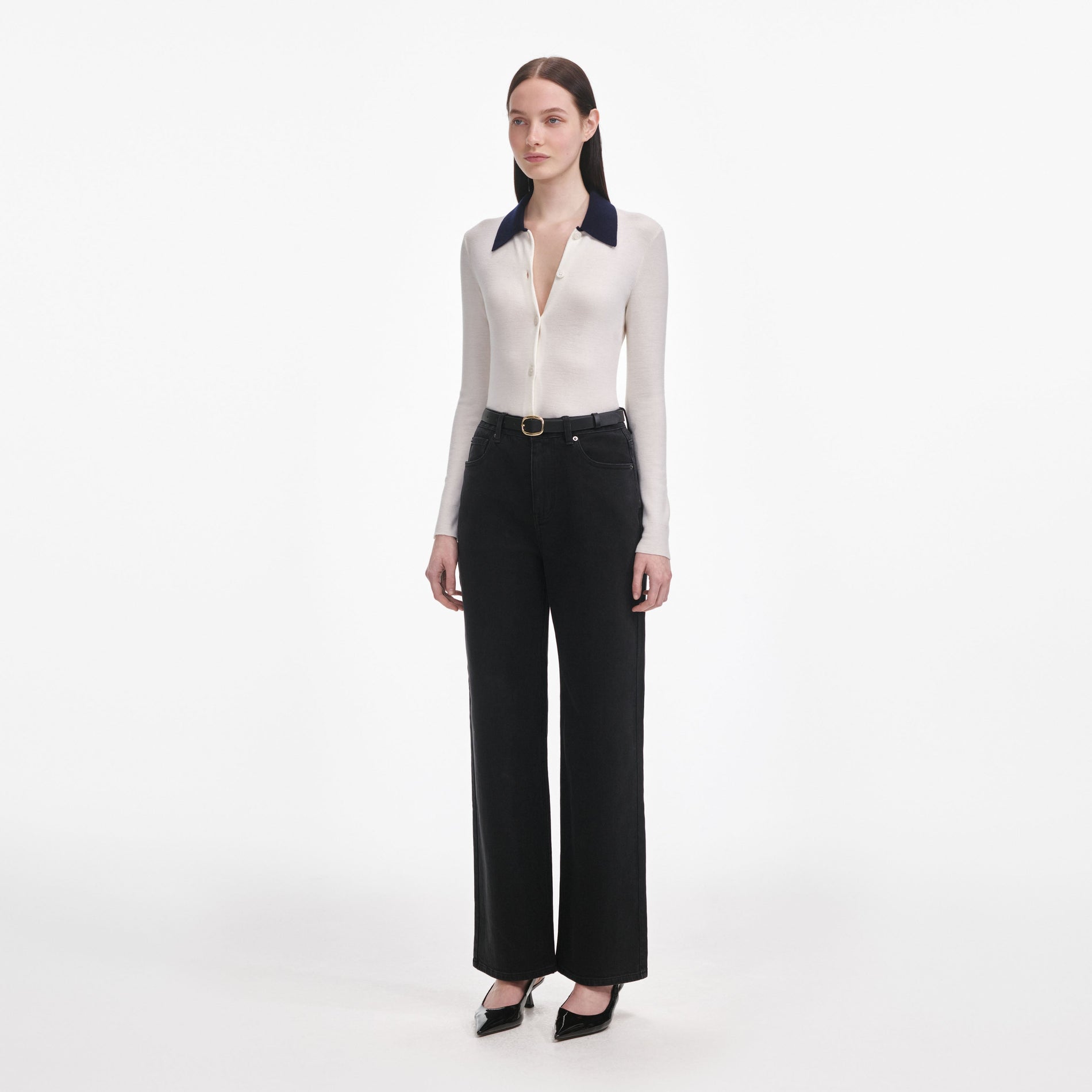 Side view of a woman wearing the Black Straight Leg Jeans