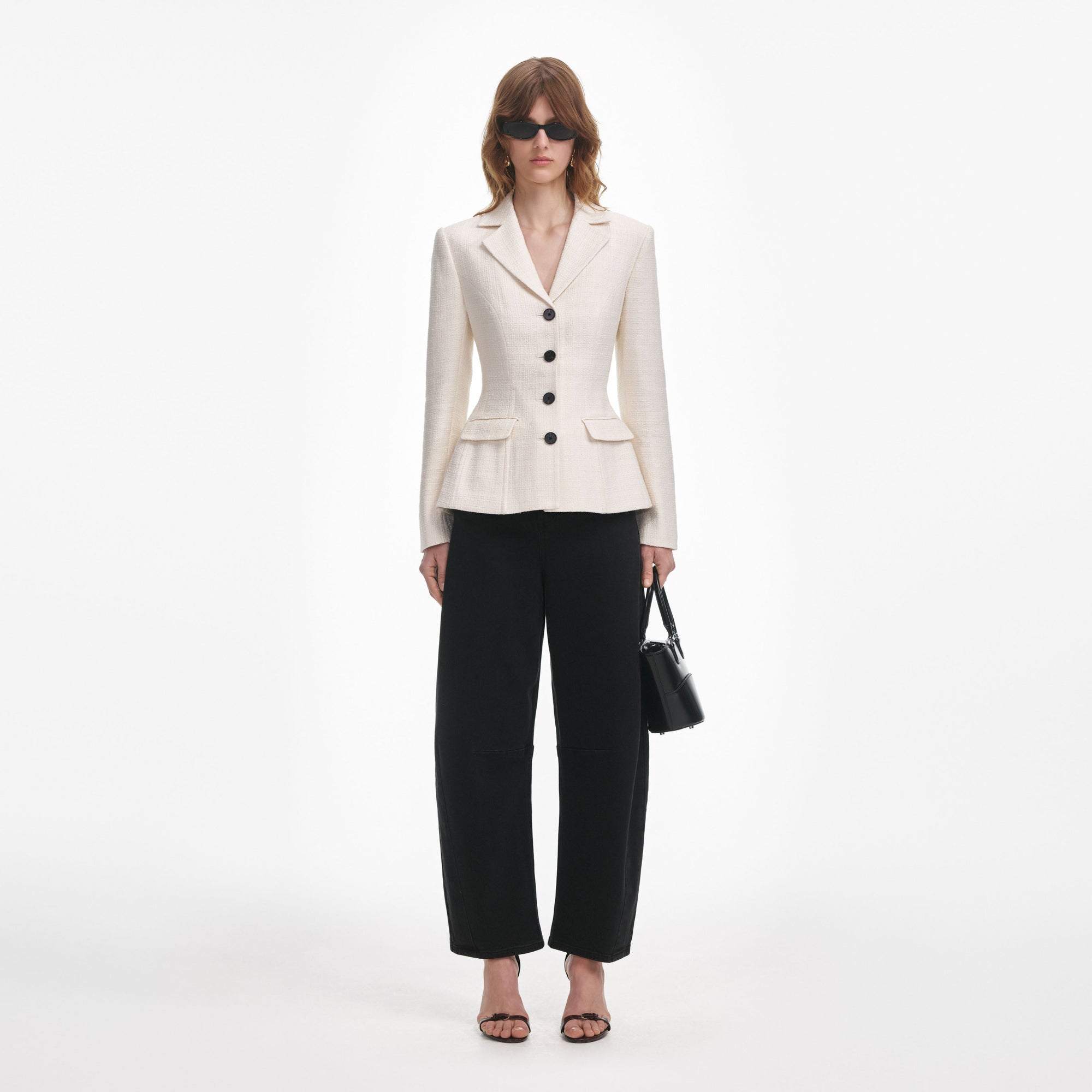 Front view of a woman wearing the Cream Boucle Jacket