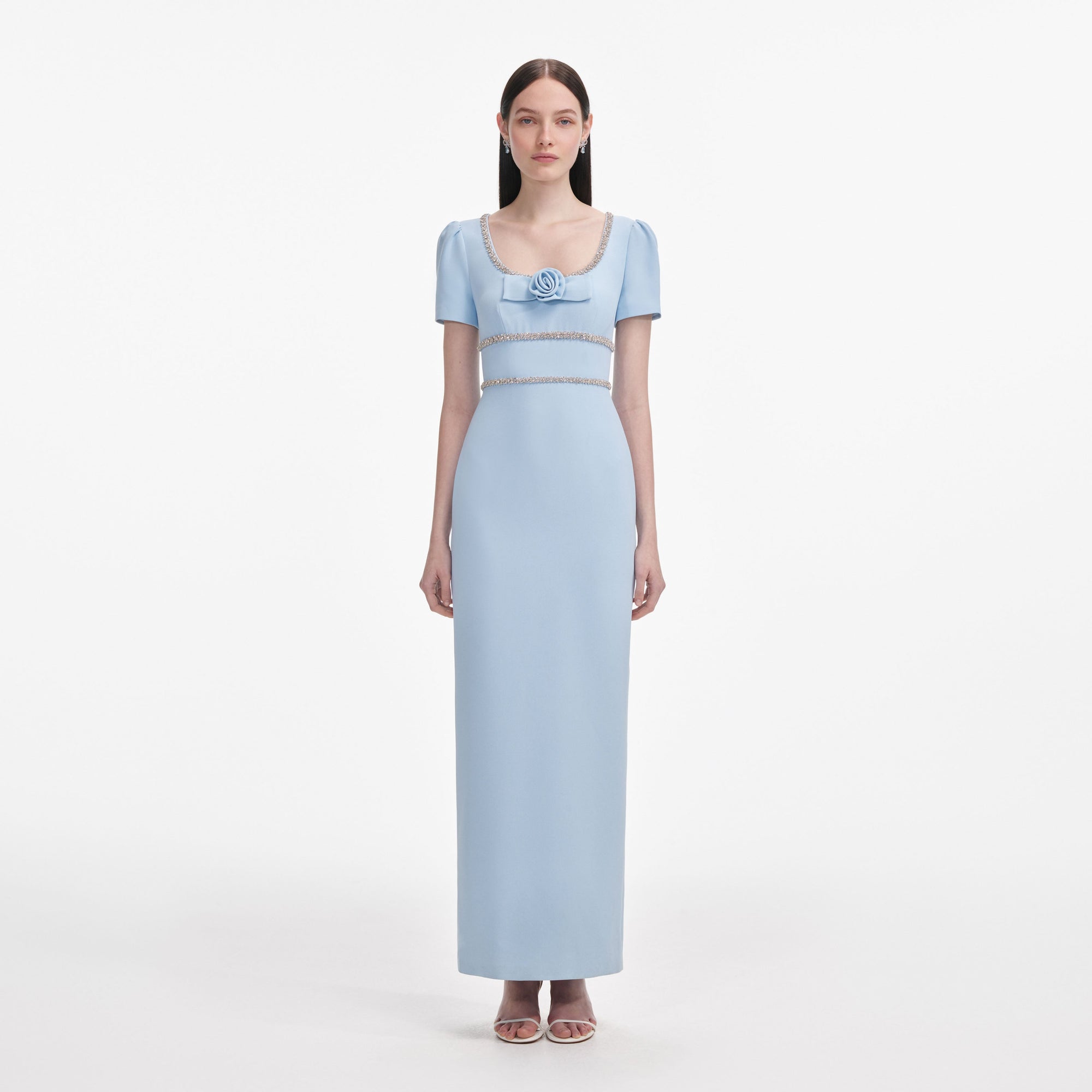 Front view of a woman wearing the Blue Crepe Crystal Trim Maxi Dress