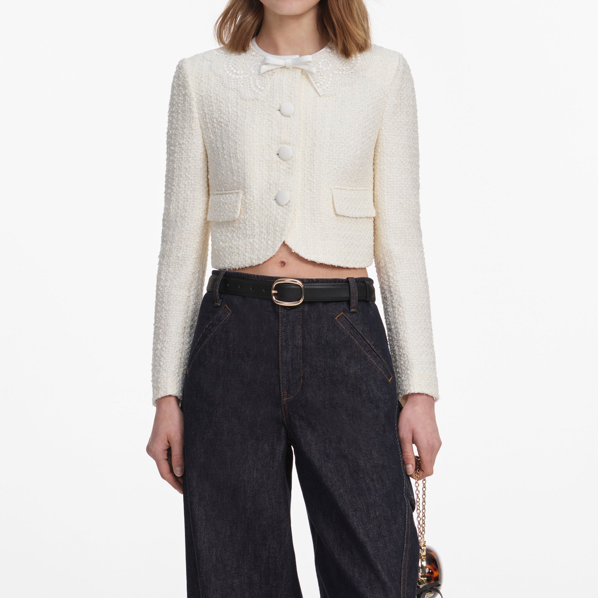 A close up of a woman wearing the Cream Boucle Lace Collar Jacket