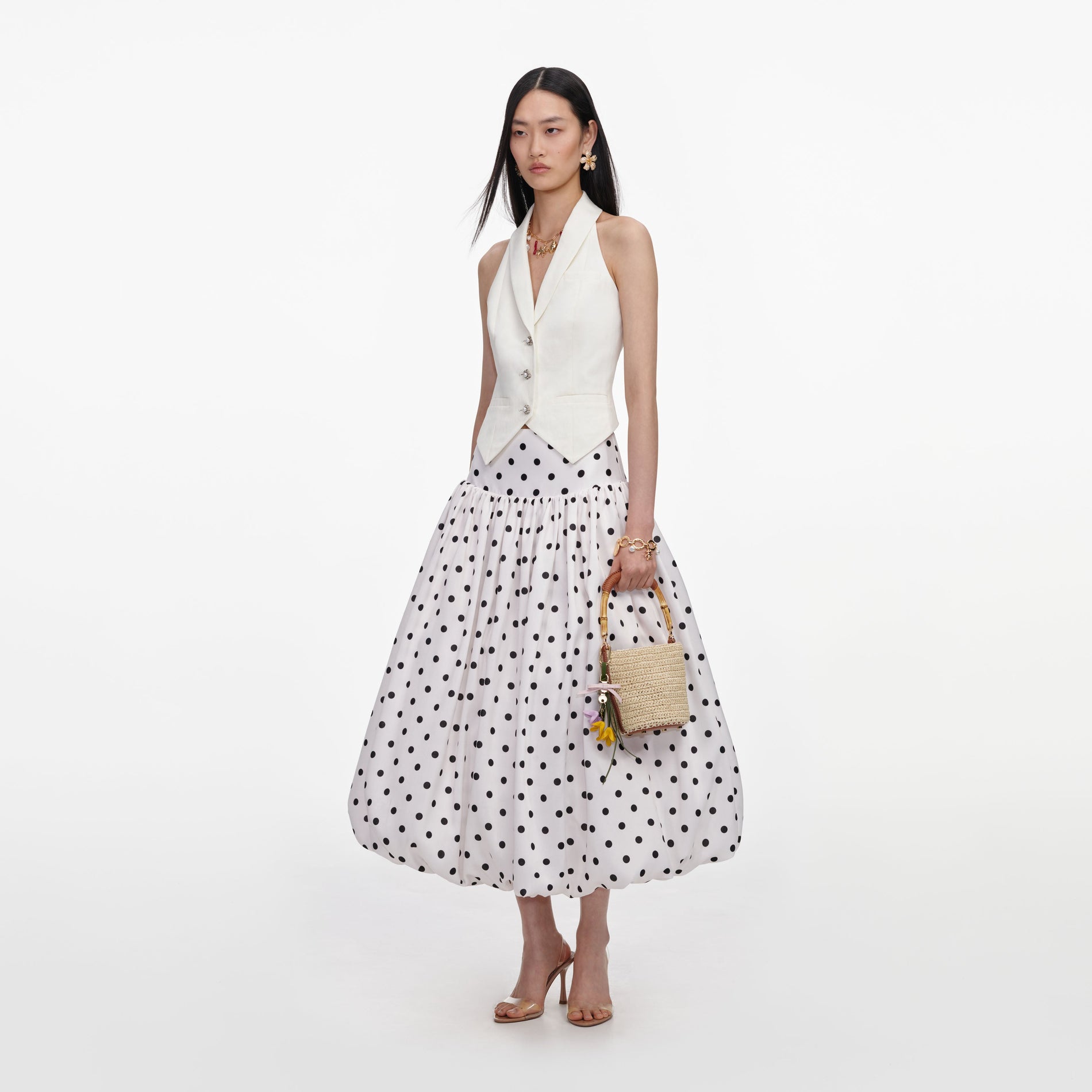 Side view of a woman wearing the Cream Linen Blend Waistcoat