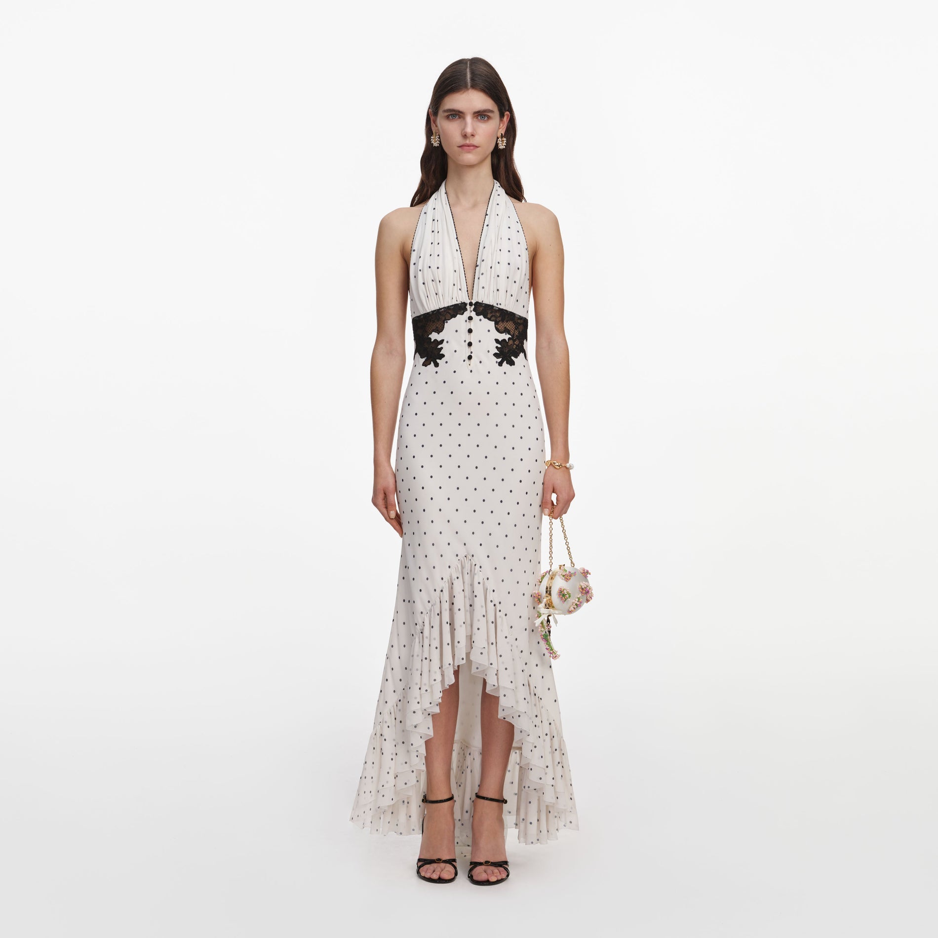 Front view of a woman wearing the Polka Dot Halter Neck Midi Dress