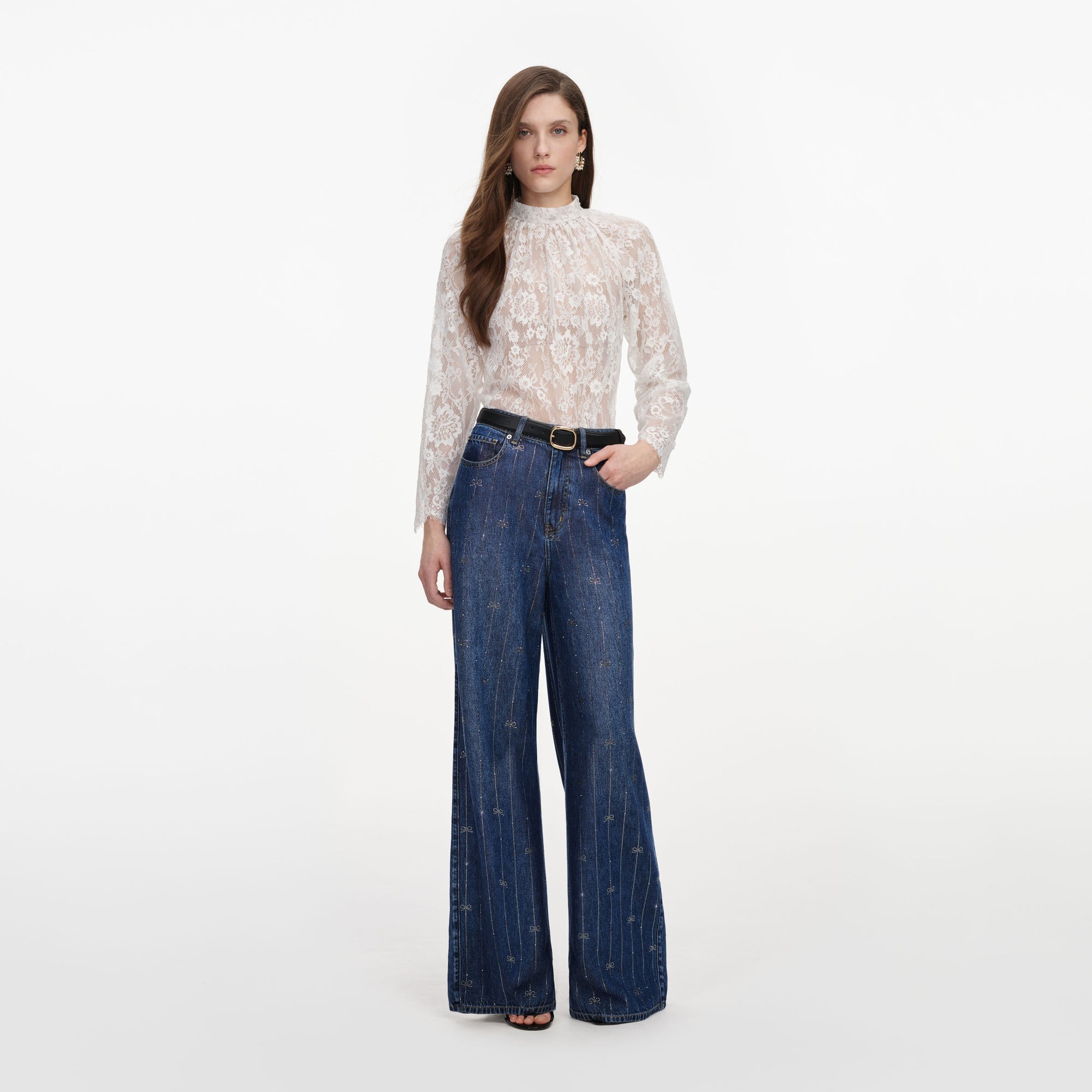 Front view of a woman wearing the Rhinestone Stripe Denim Jeans