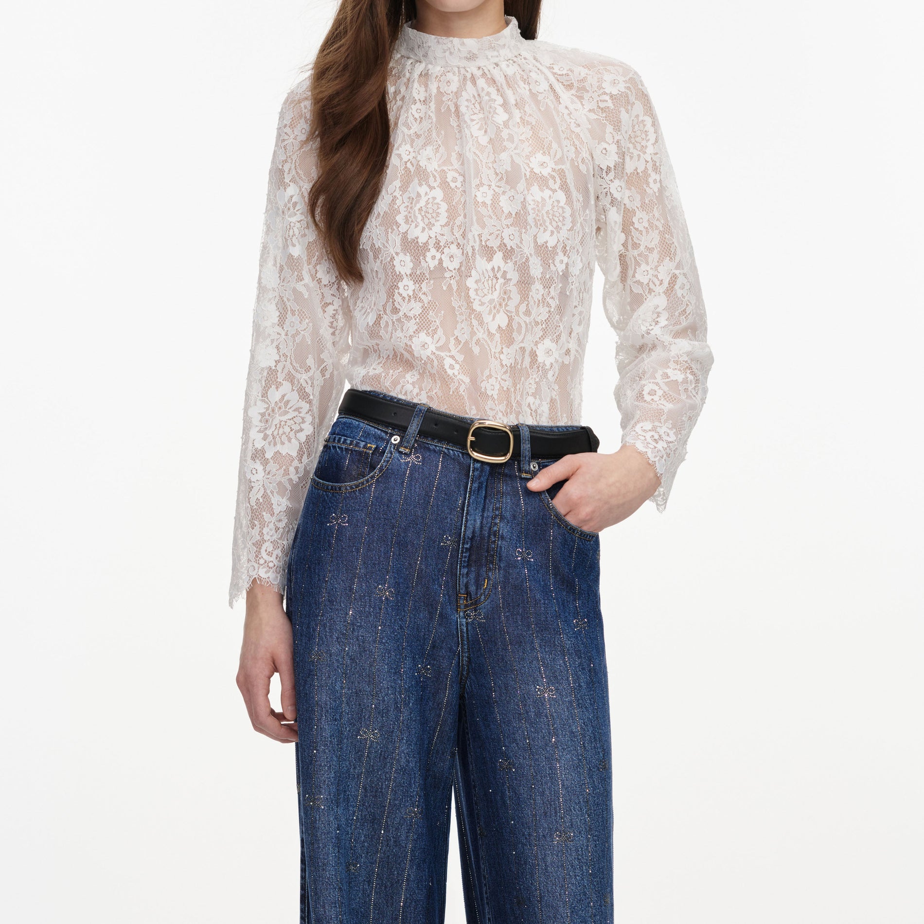 A close up of a woman wearing the White Lace Blouse