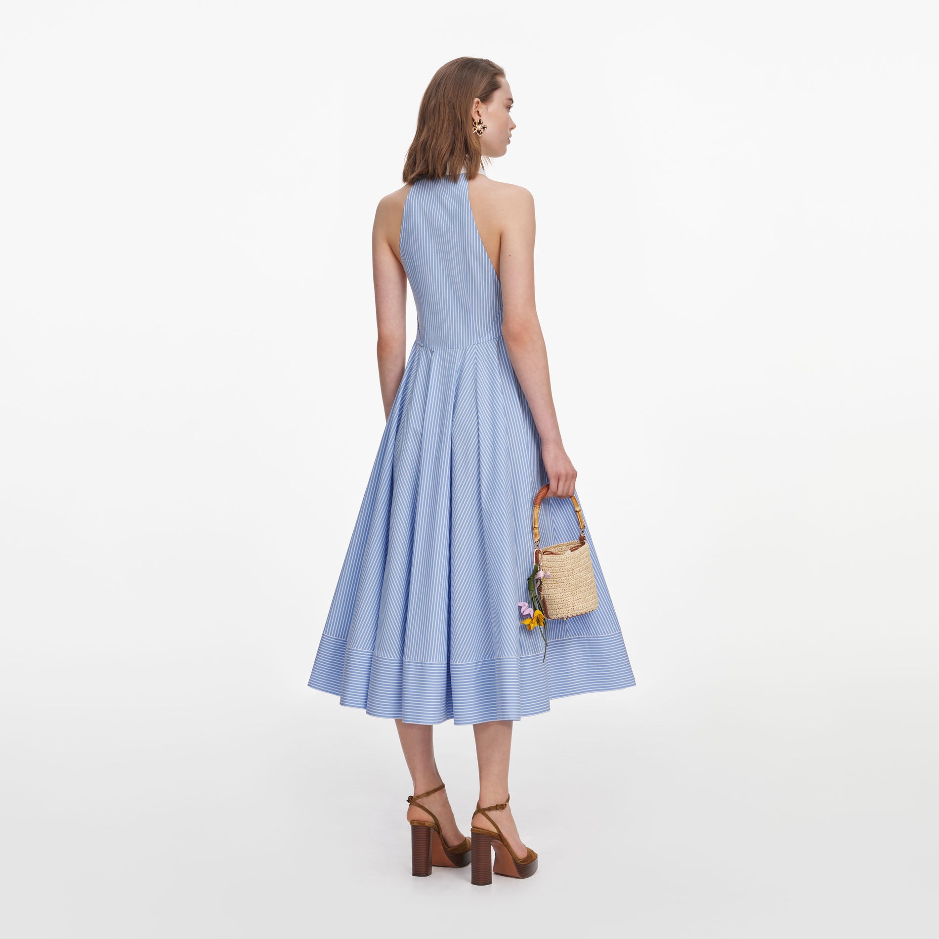Back view of a woman wearing the Blue Striped Cotton Midi Dress