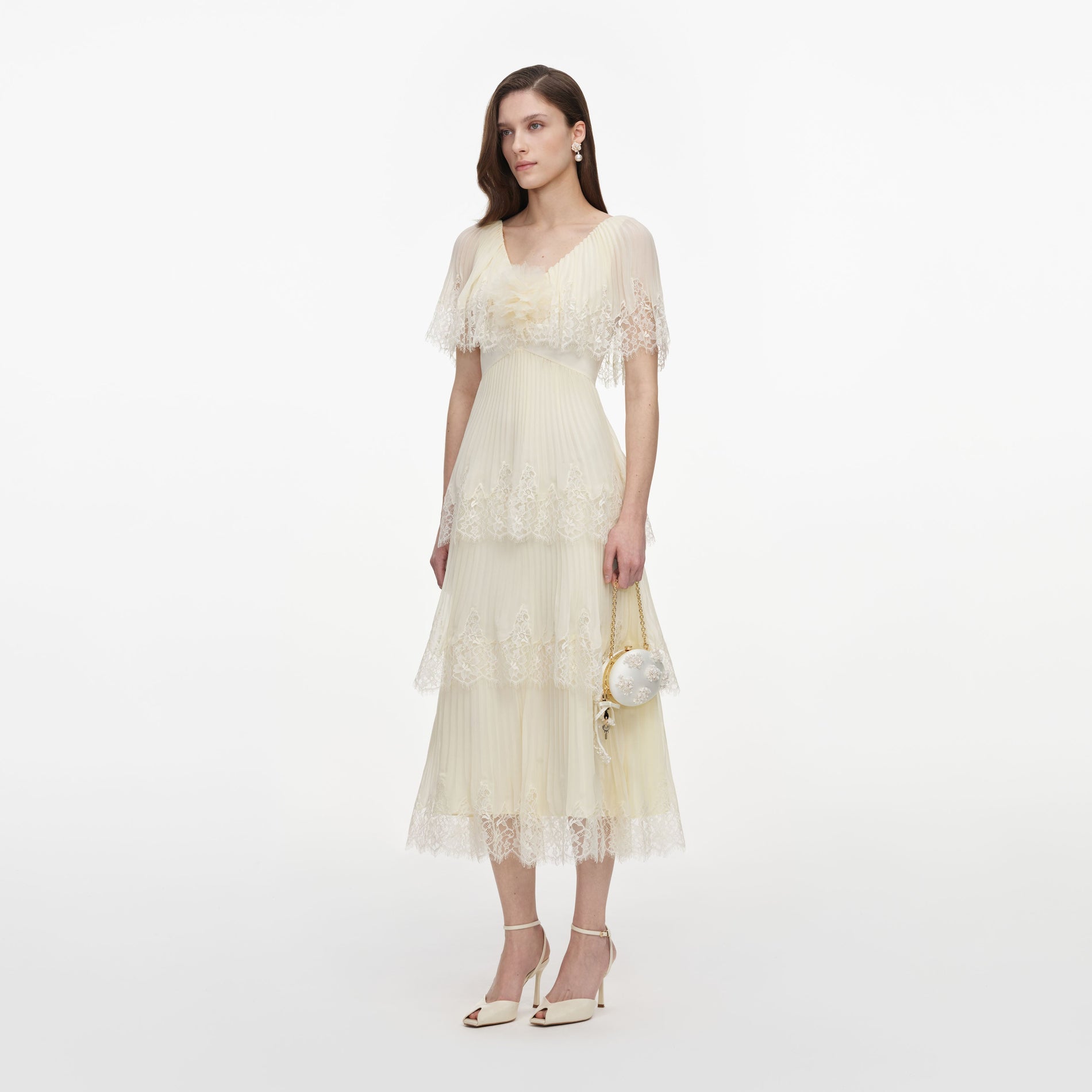 Side view of a woman wearing the Yellow Chiffon Tiered Midi Dress